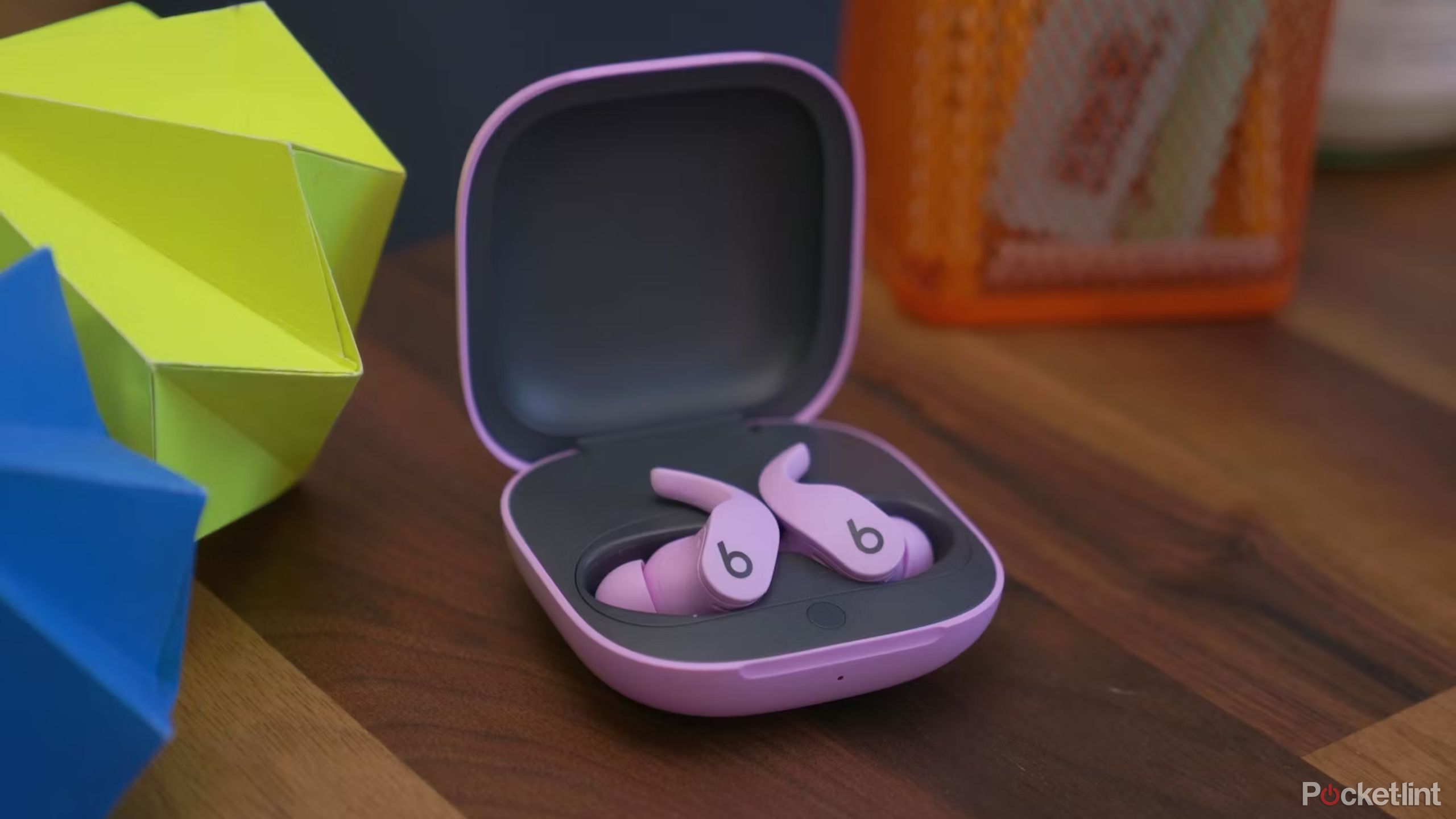 Pink Beats Fit Pro buds in their case. 