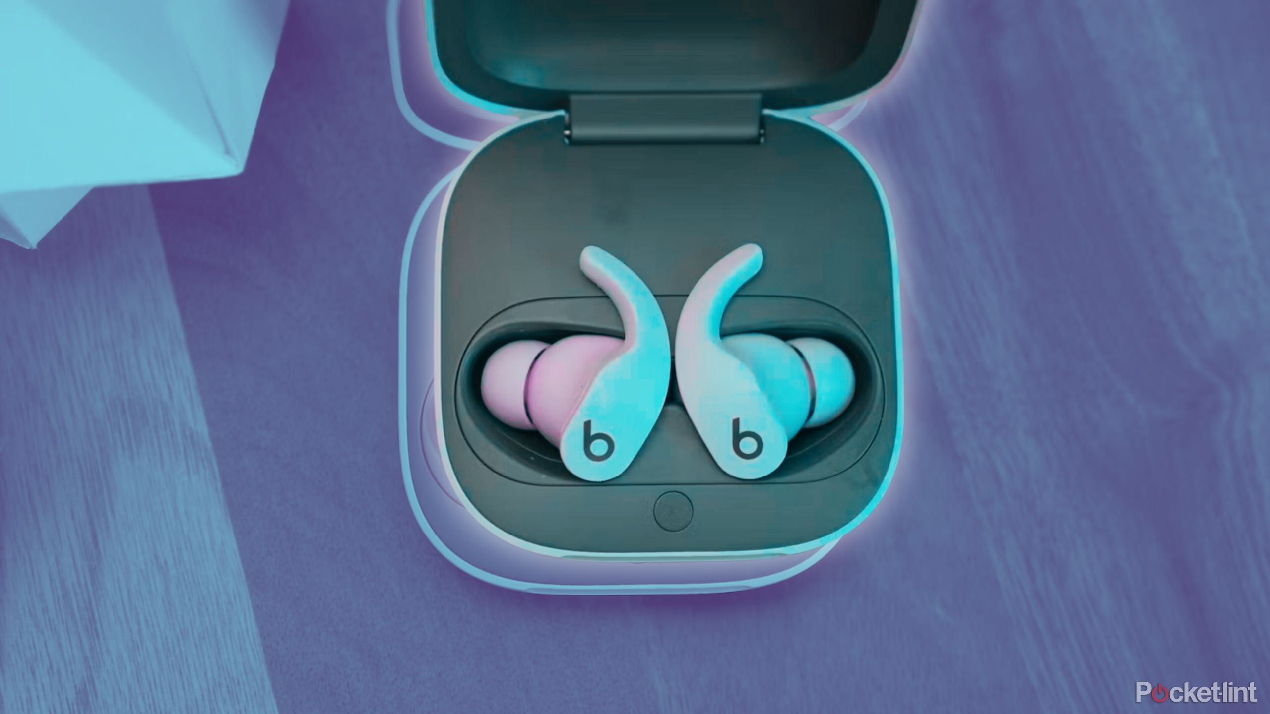 Lavender-color Beats Fit Pros in their charging case.