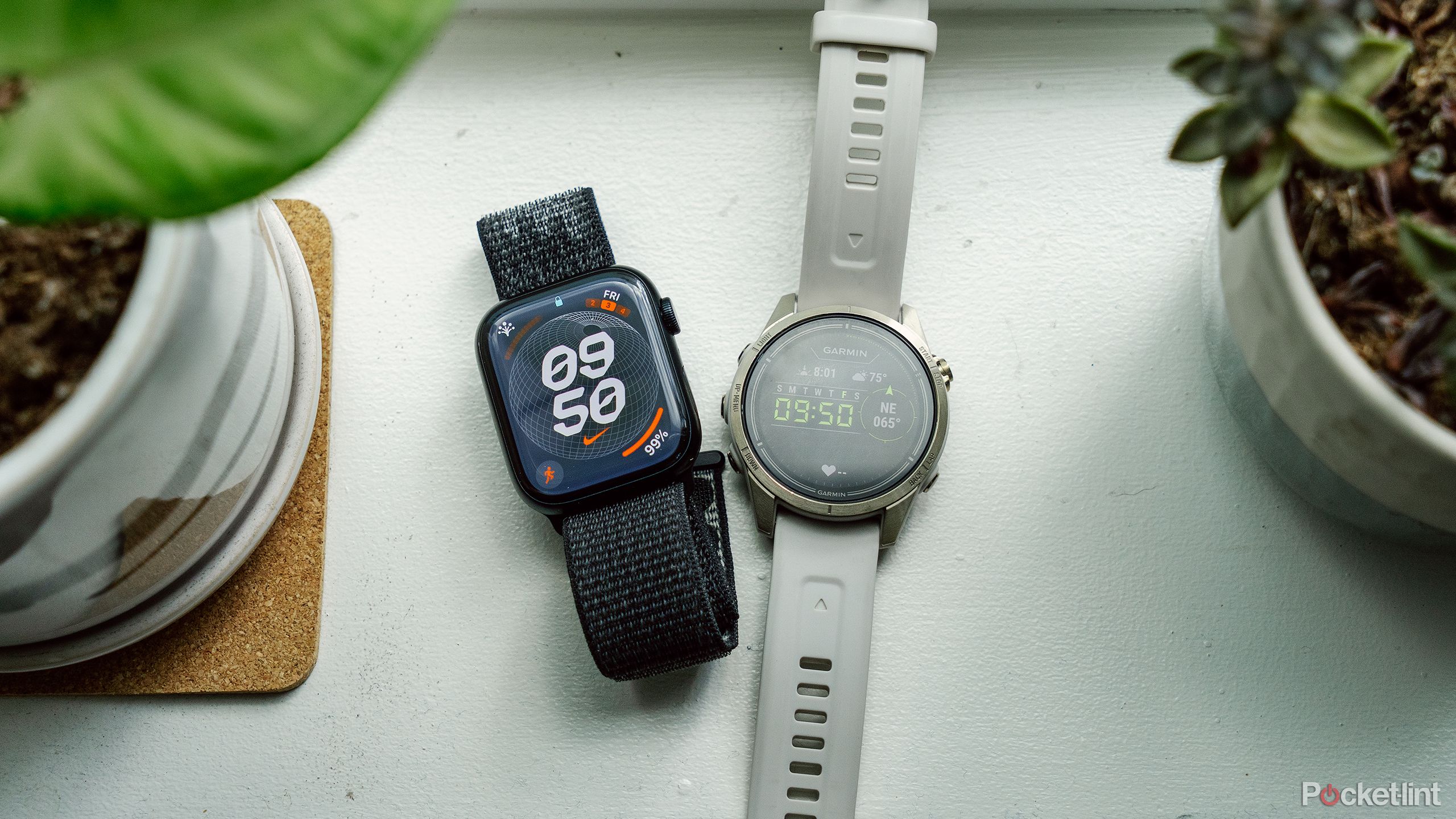 The Apple Watch next to the Garmin epix Pro