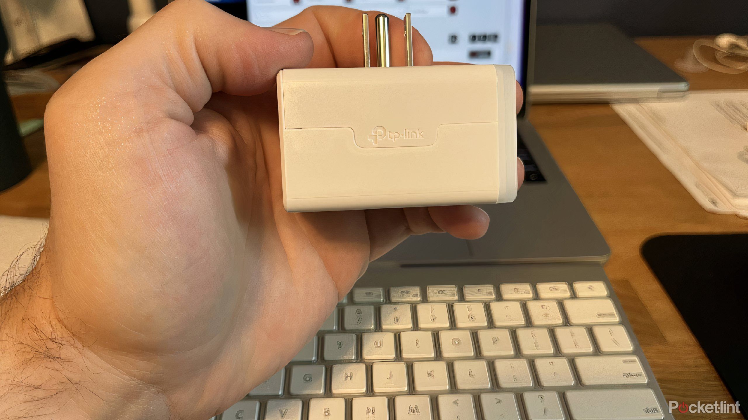 The Kasa Matter smart plug in a hand