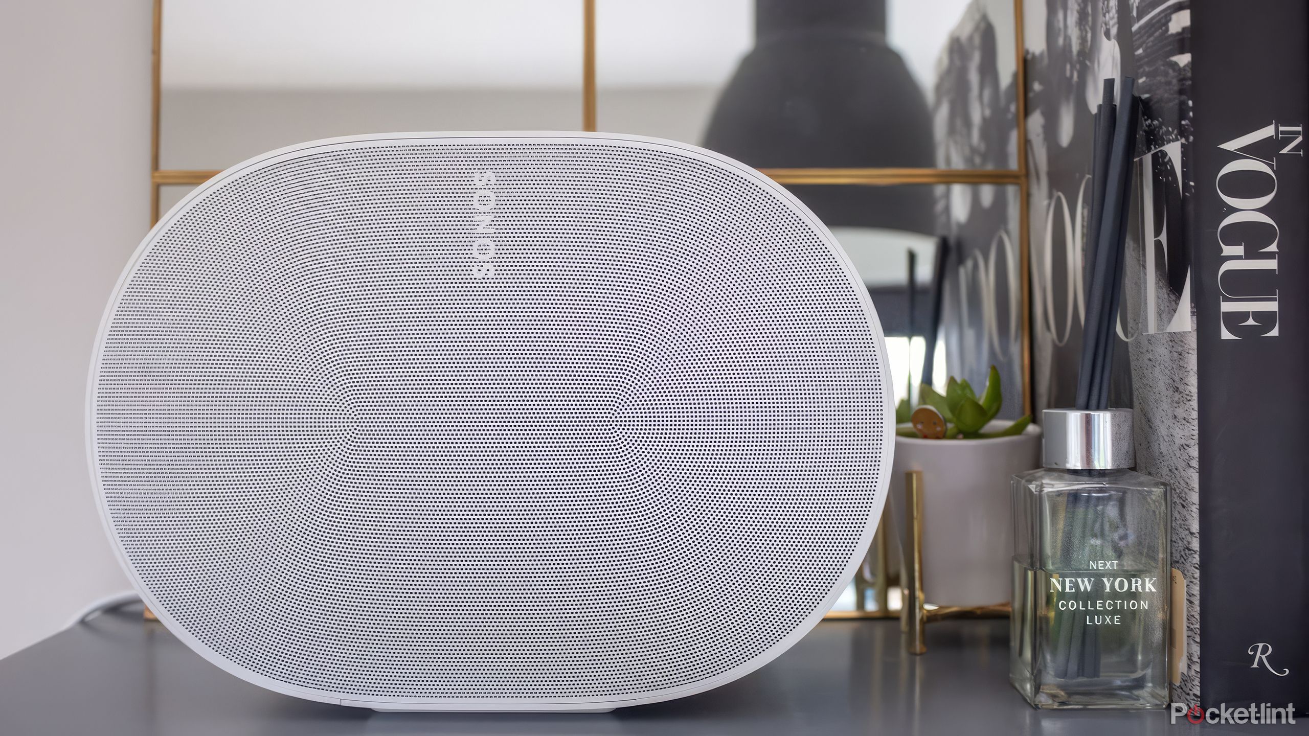 The Sonos Era 300 on a bookshelf. 