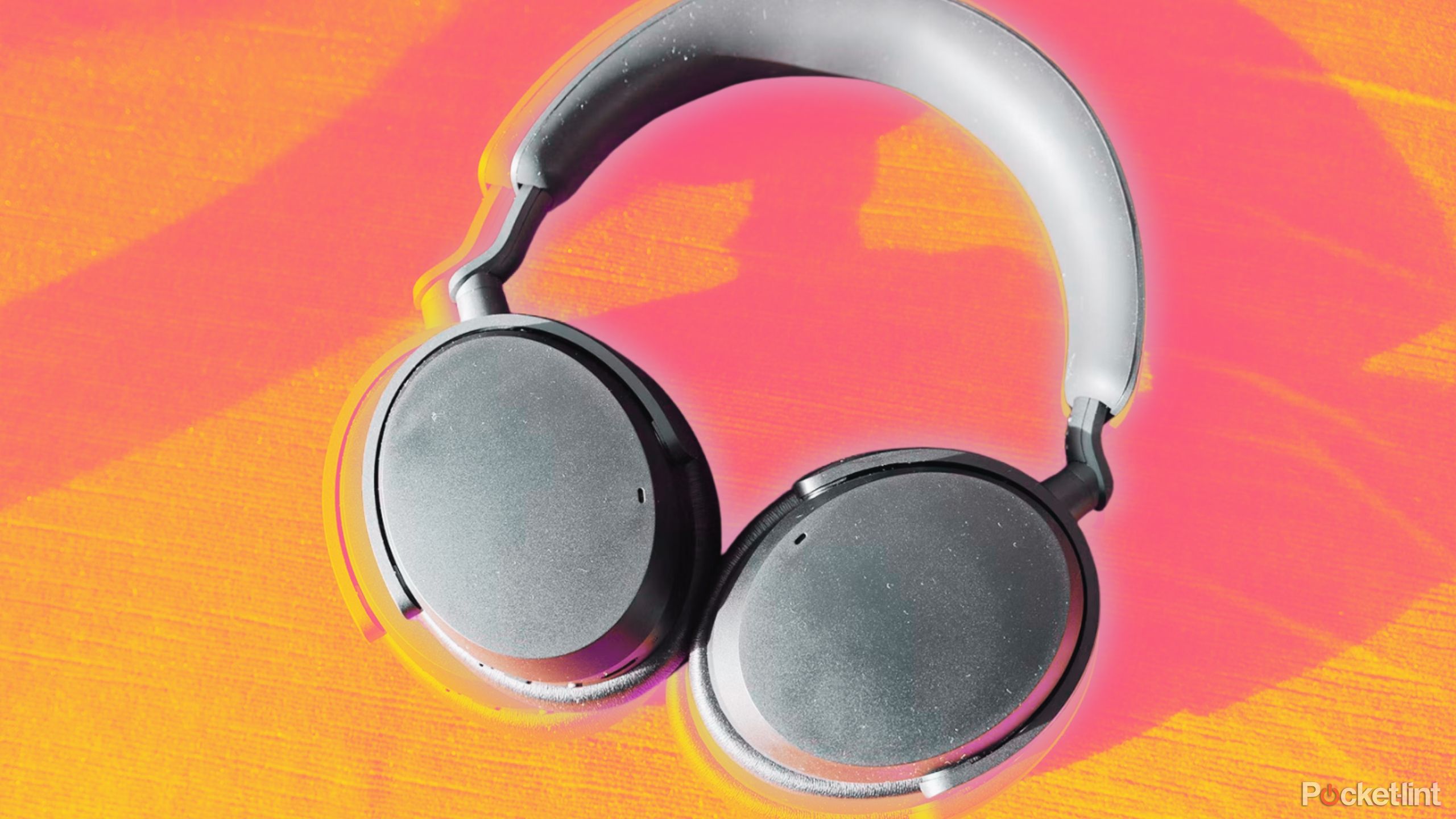 Sennheiser Accentum 3 headphones against an orange and pink background.