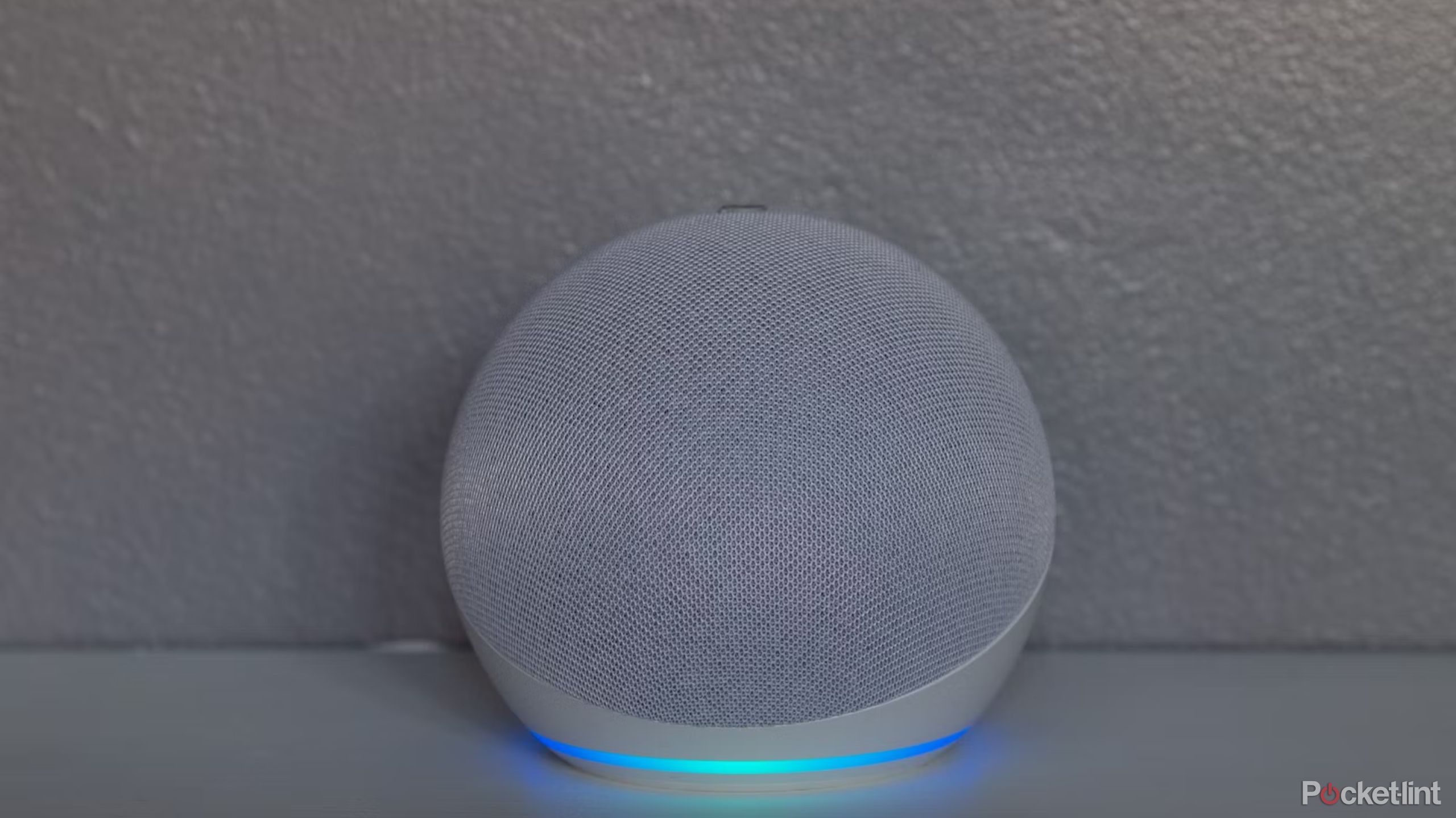 echo dot 2020 against a white wall. 