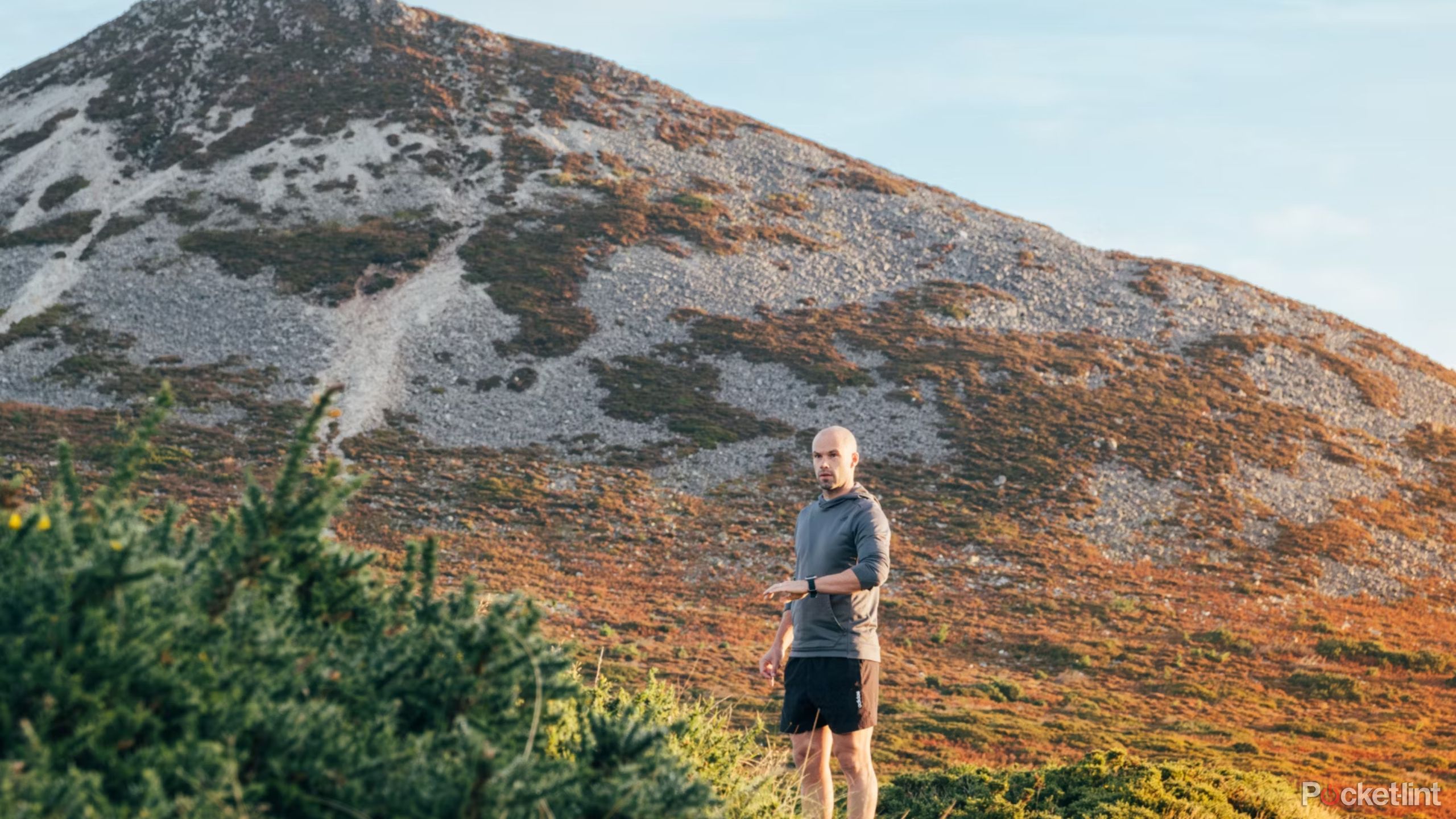 A person wearing the Apple Watch Ultra 2 on a hike