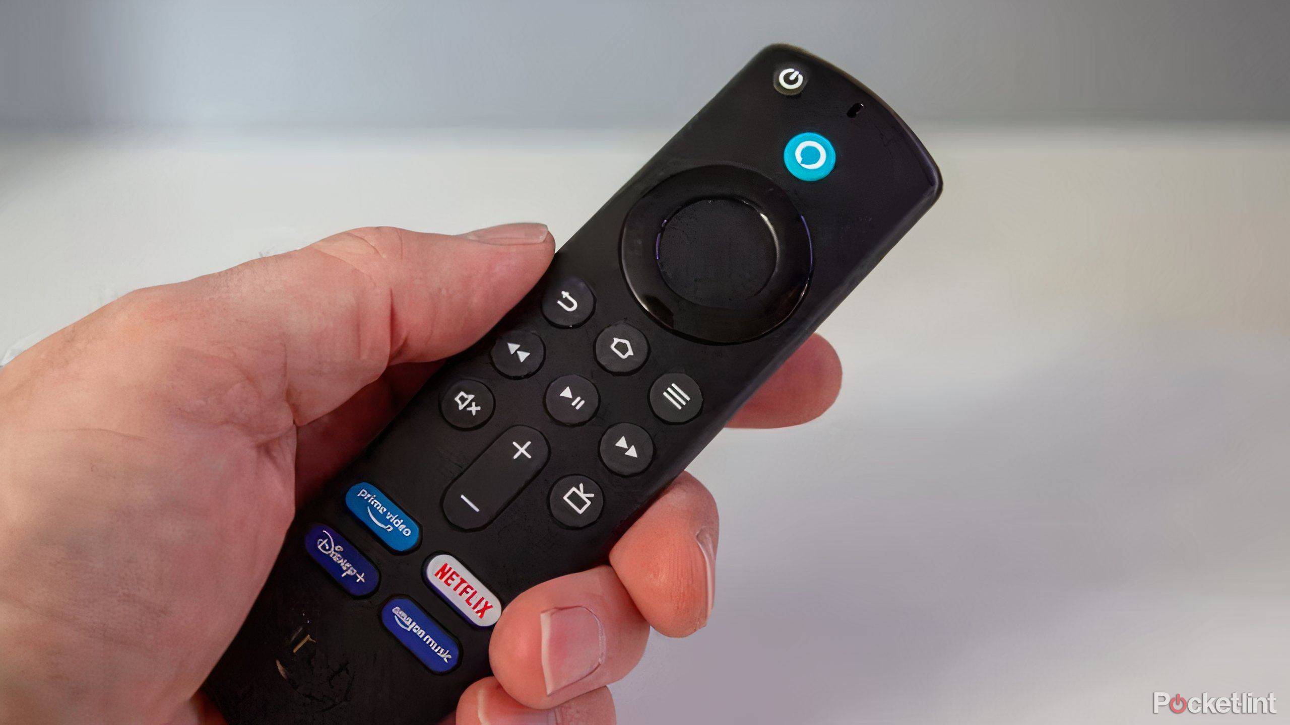 a picture of a hand holding a Fire TV Stick 4K Max