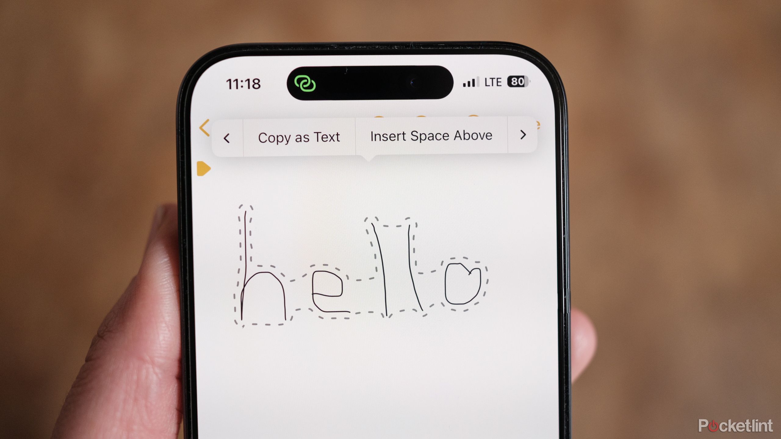 Apple Notes handwriting tool with hello written in freehand on an iPhone screen. 
