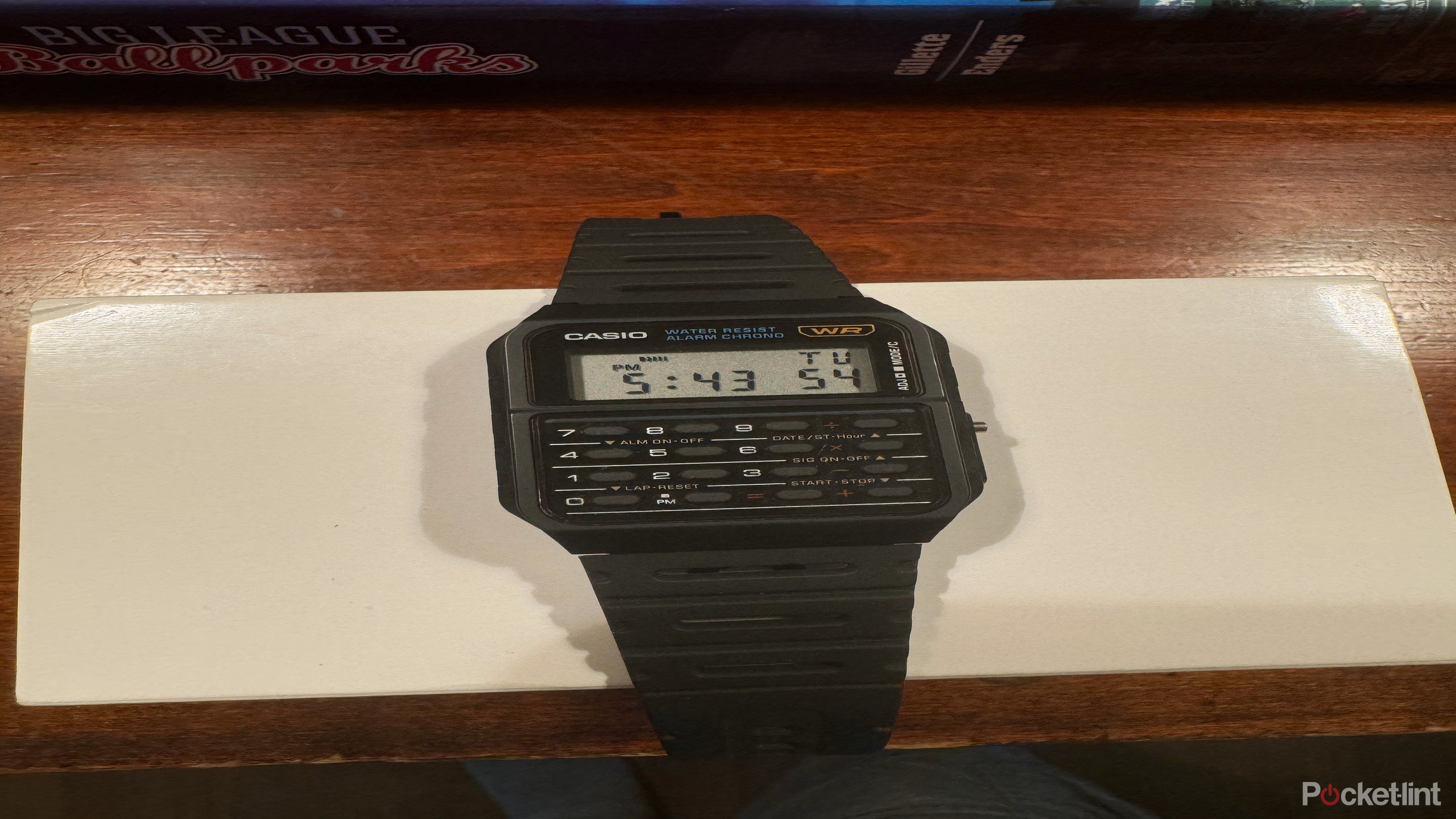 casio watchface on white cardboard