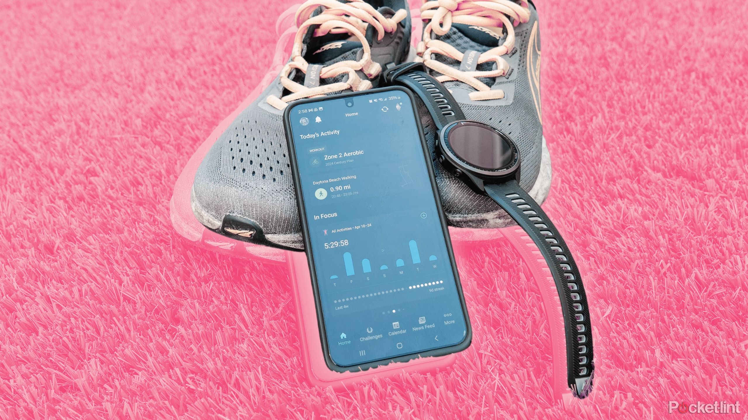 A smartphone with Garmin Connect is propped up against a pair of running shoes with a Garmin Forerunner 965 watch attached. 