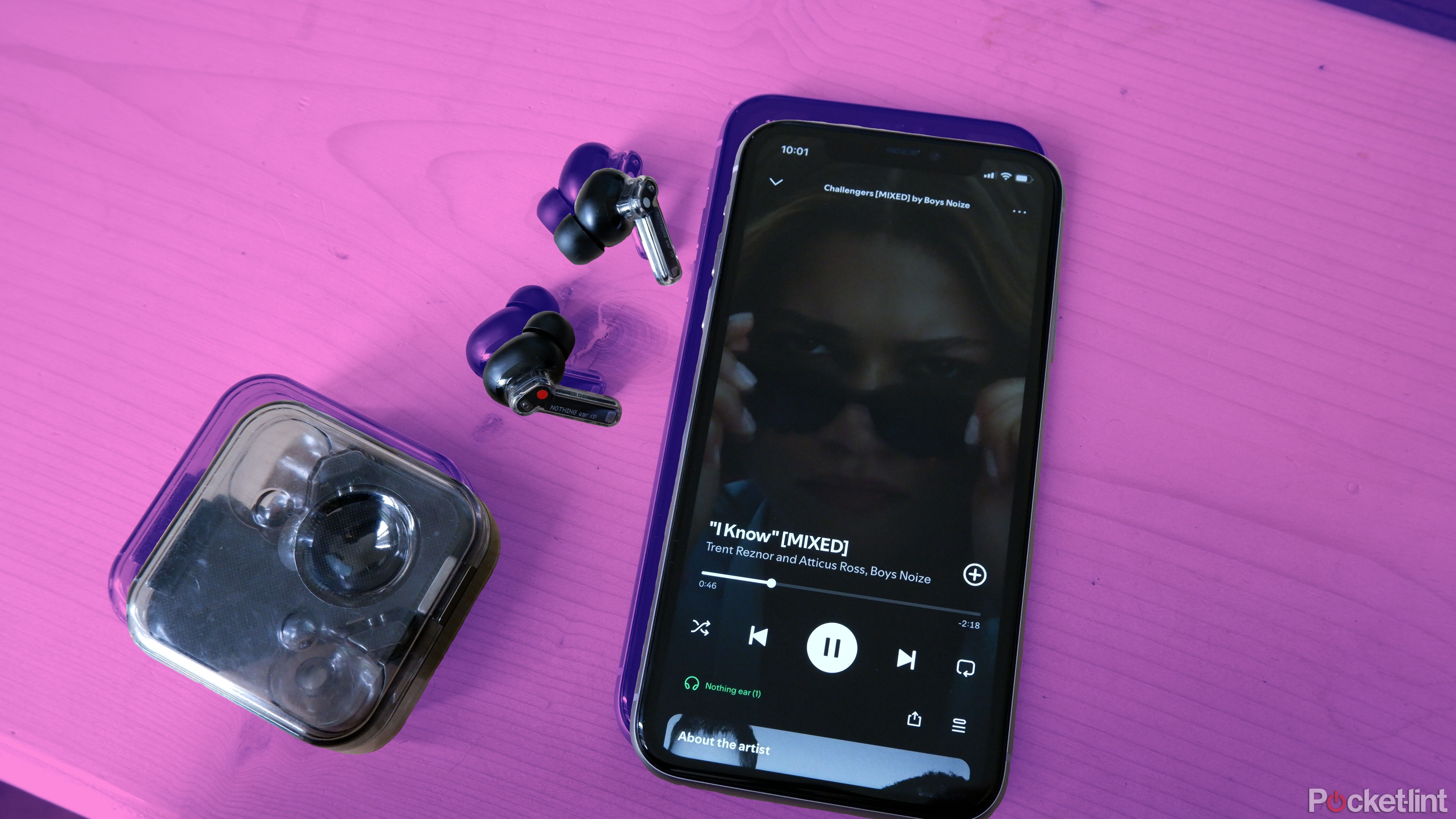 An iPhone with Spotify open, playing 