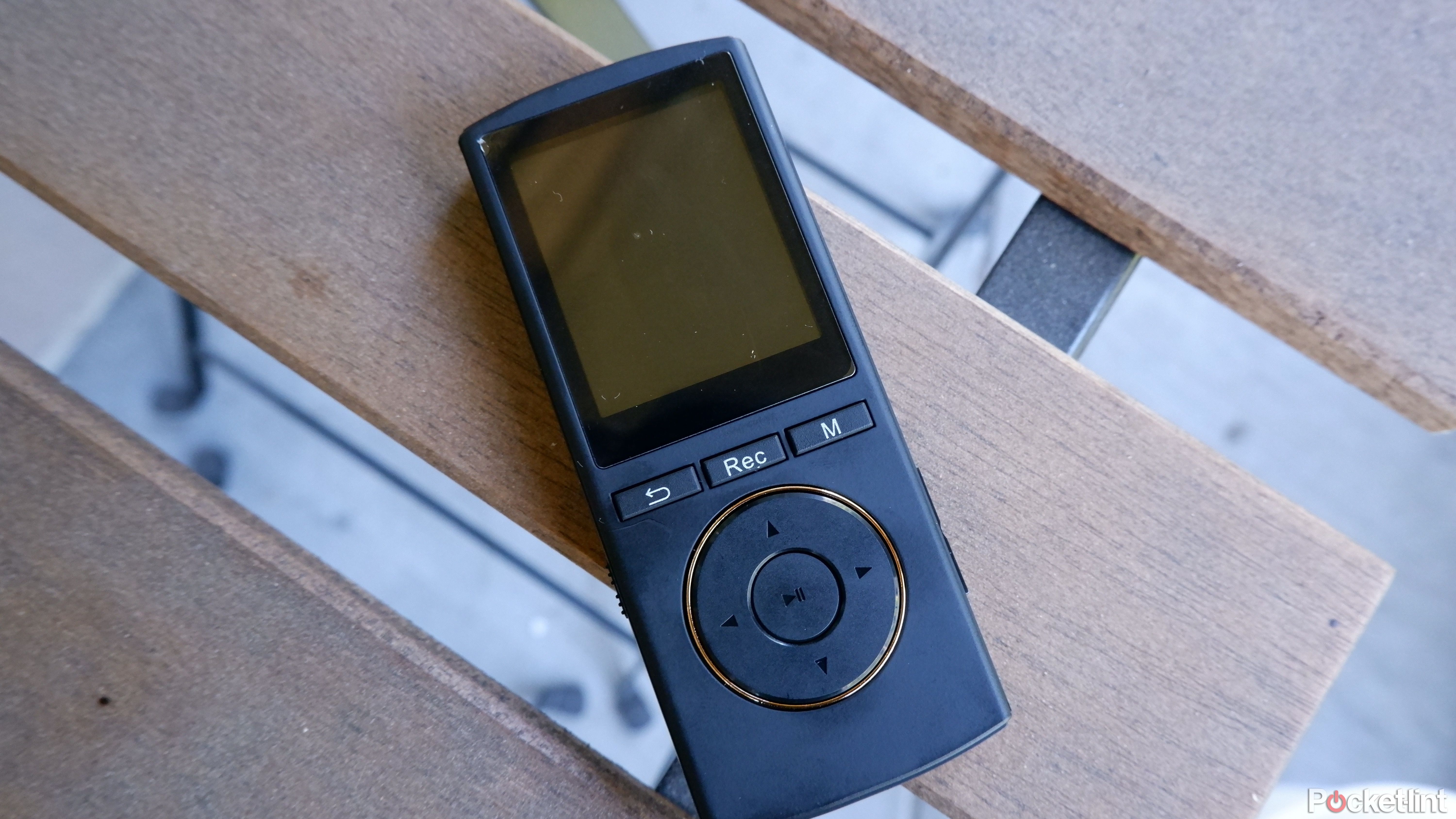 The Safuciiv MP3 player on a patio table
