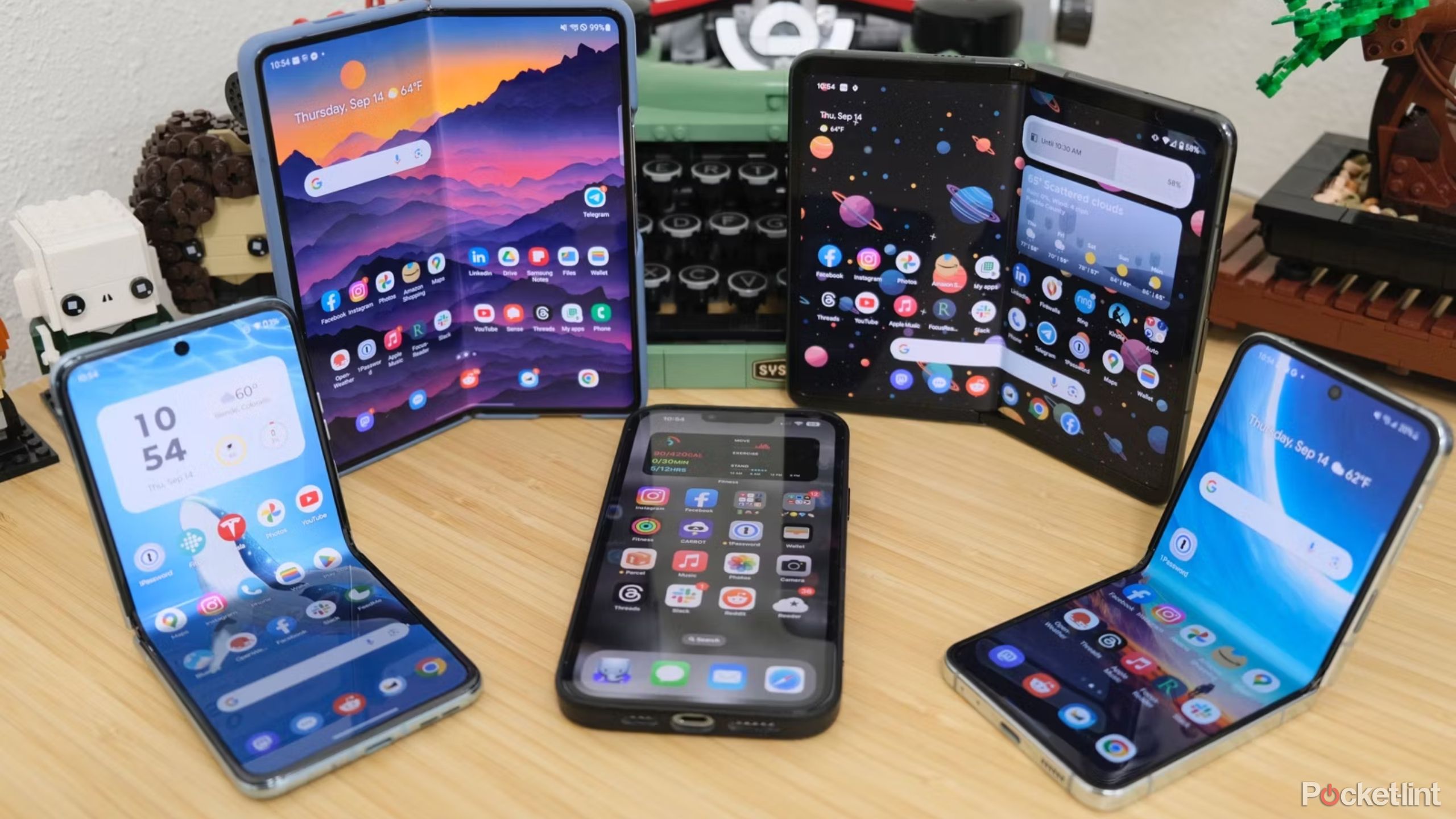 foldable phones with an iPhone 13 Pro max in a semicircle 