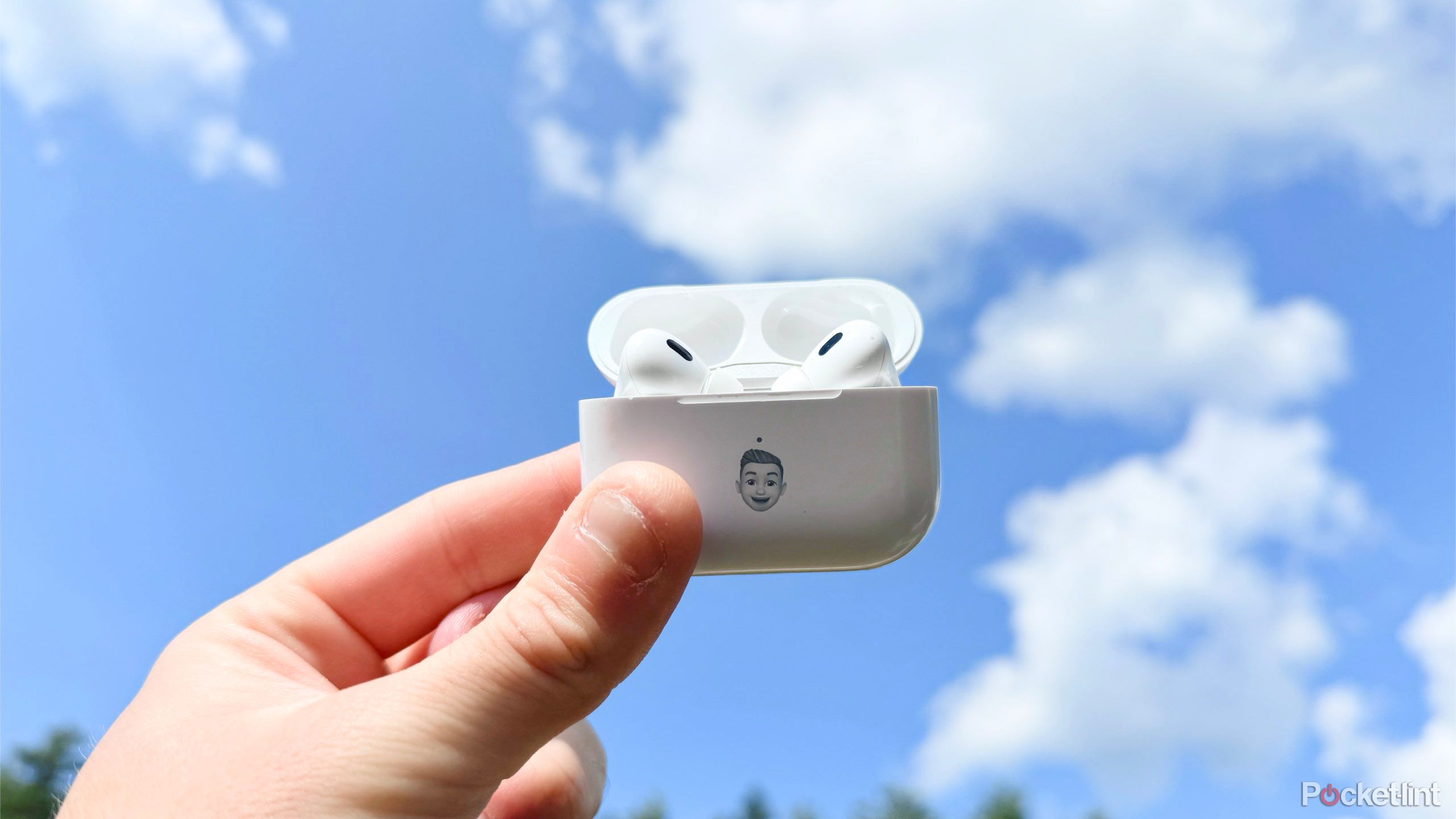 Apple AirPods Pro against the blue sky.