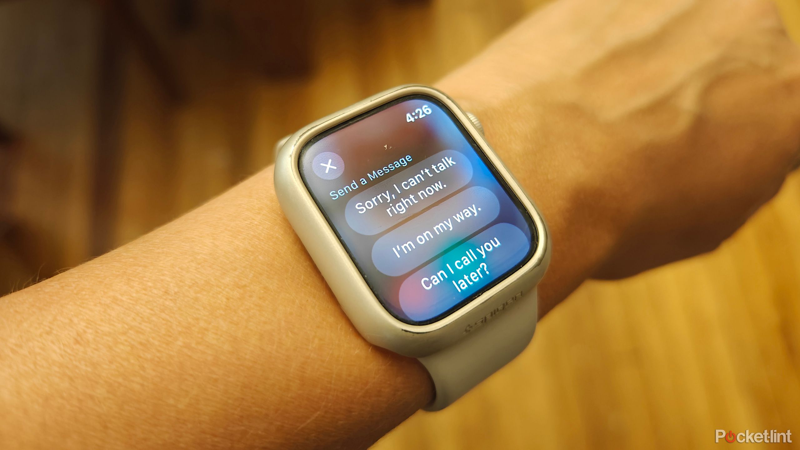 An Apple Watch showing quick reply options for an incoming call