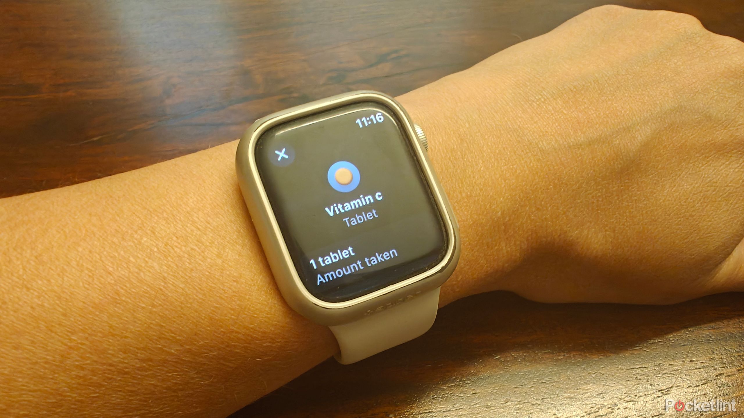 An Apple Watch showing a medication reminder to take Vitamin C