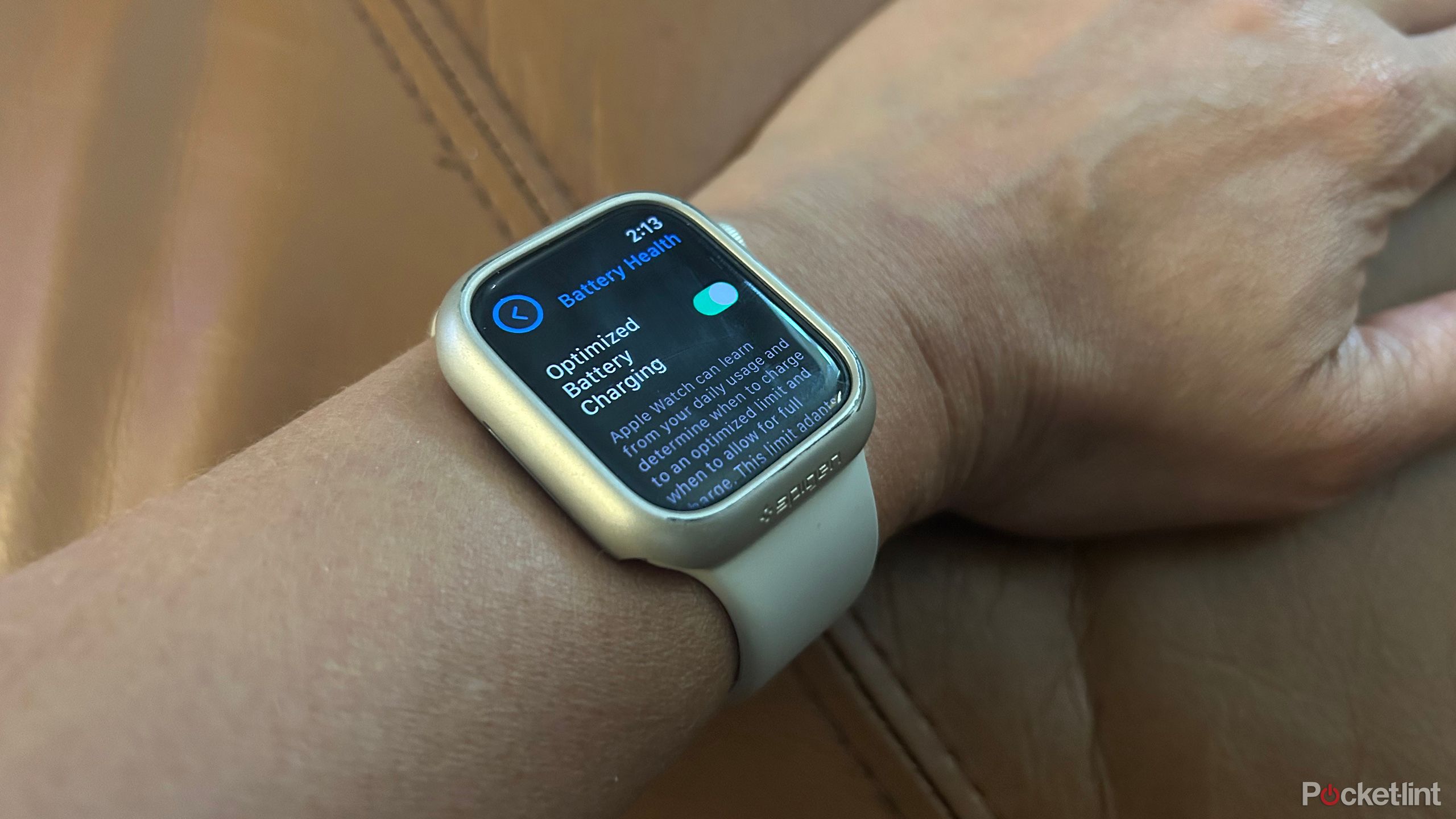 An Apple Watch on a wrist with Optimized Battery Charging showing