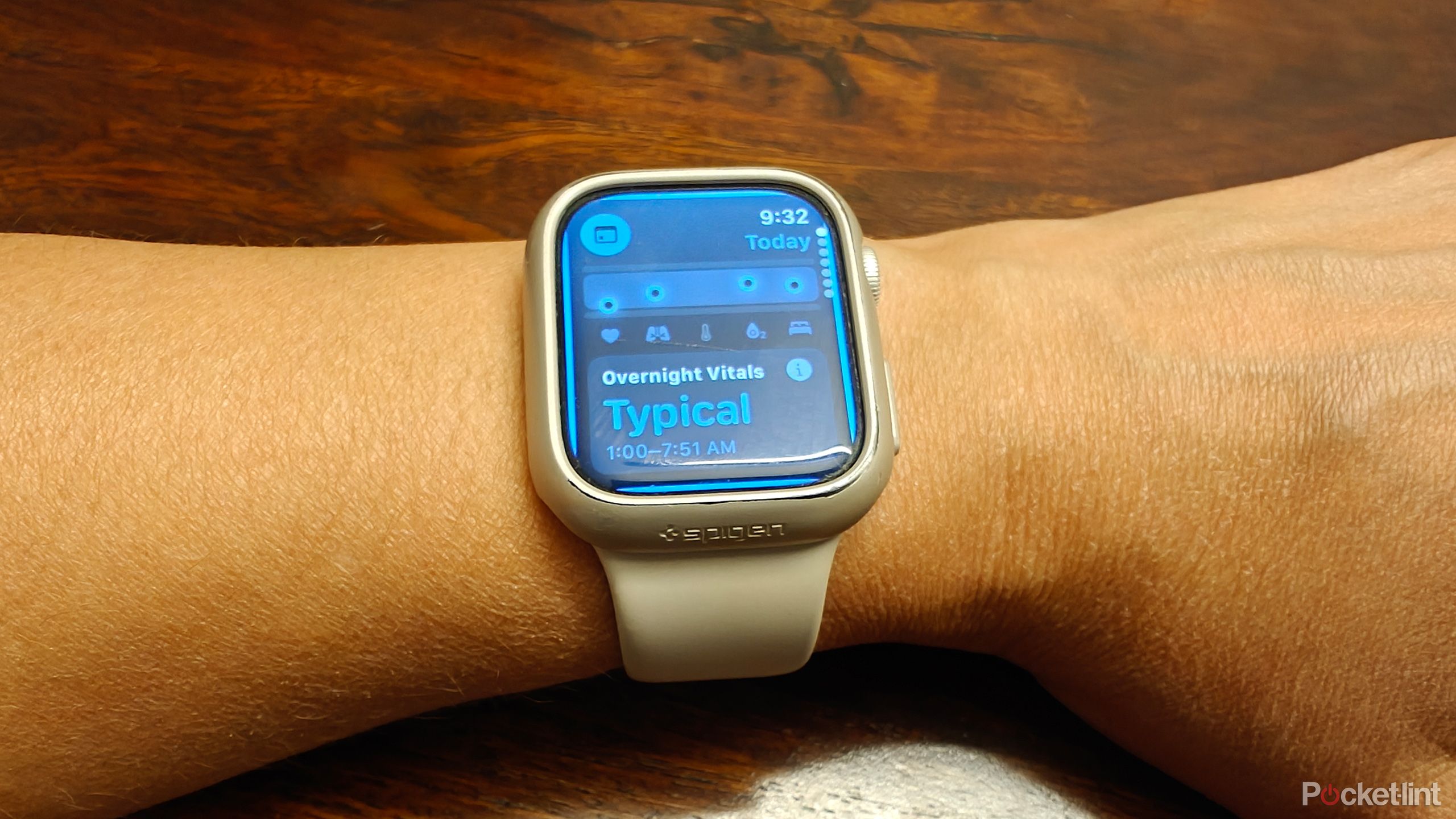 Apple Watch on a wrist showing the overnight Vitals screen.