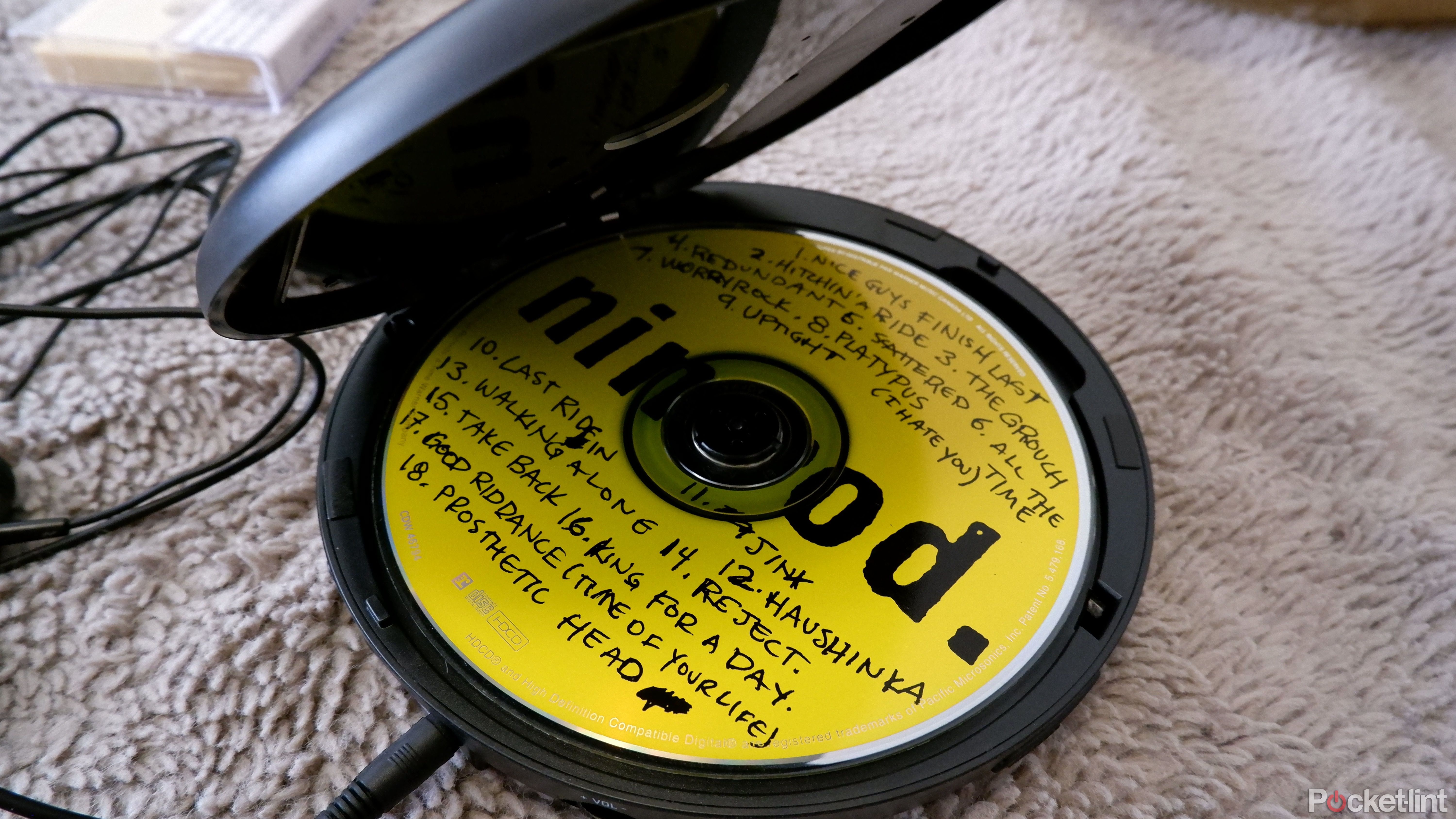 The ARAFUNA CD player open, showing the CD inside, Green Day's 1997 album Nimrod