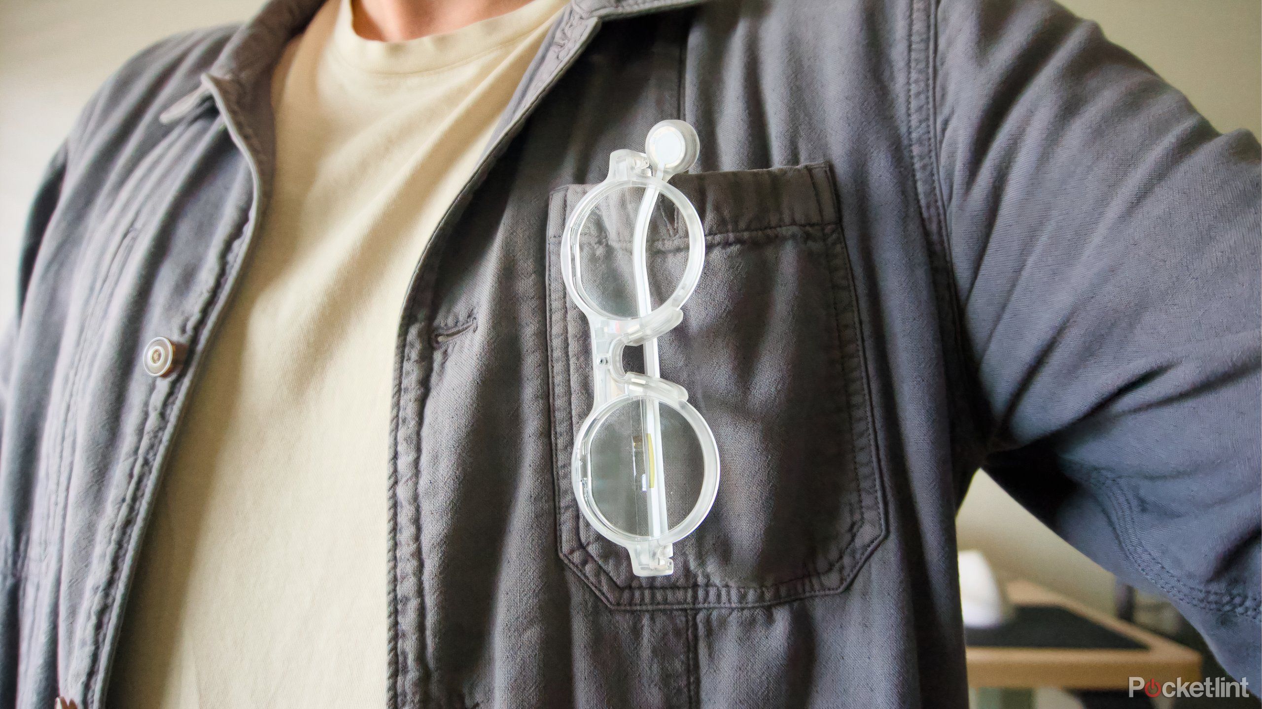 The Brilliant Labs Frame hanging from a jacket.