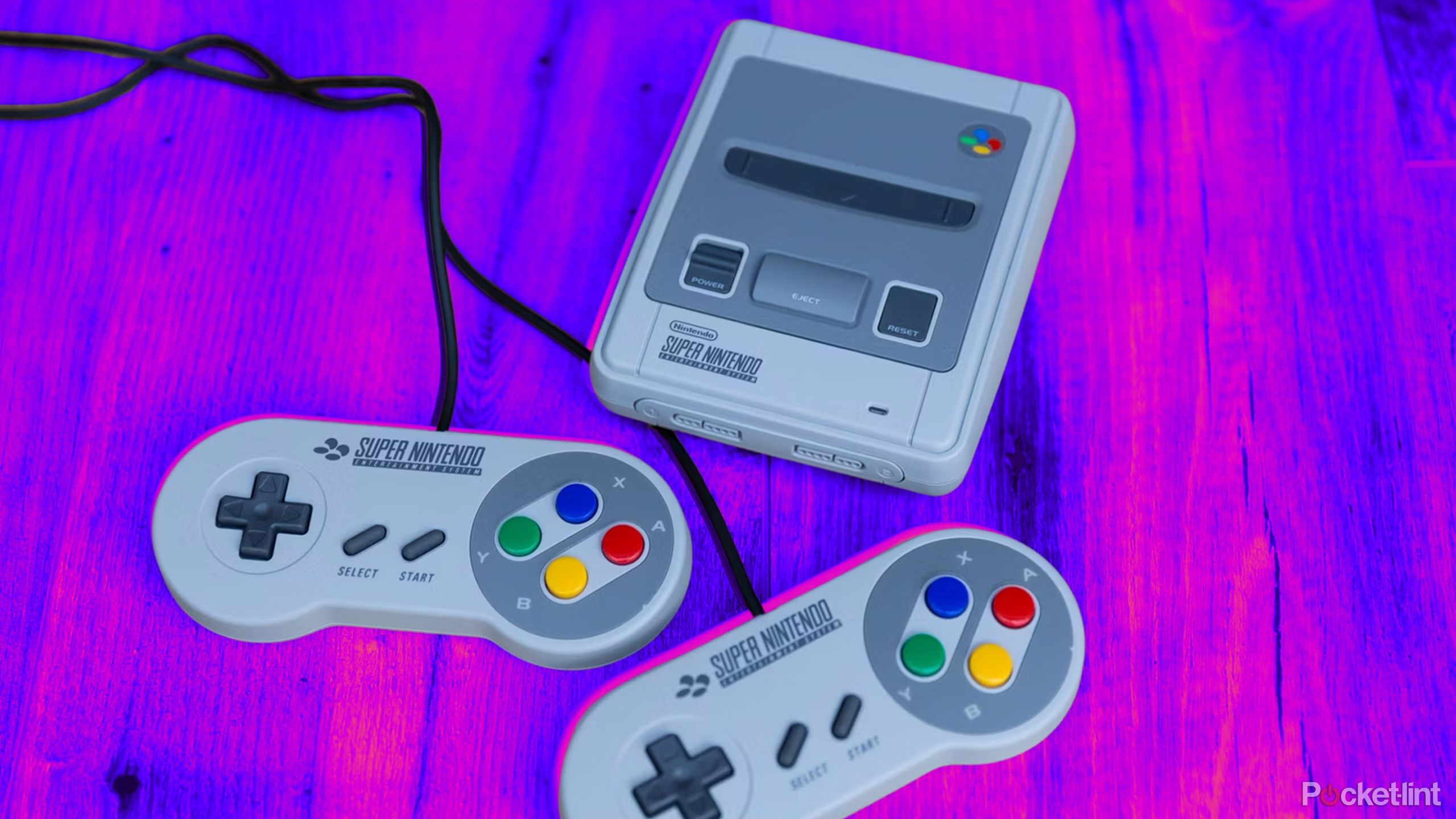 A SNES Classic Mini on a colored background