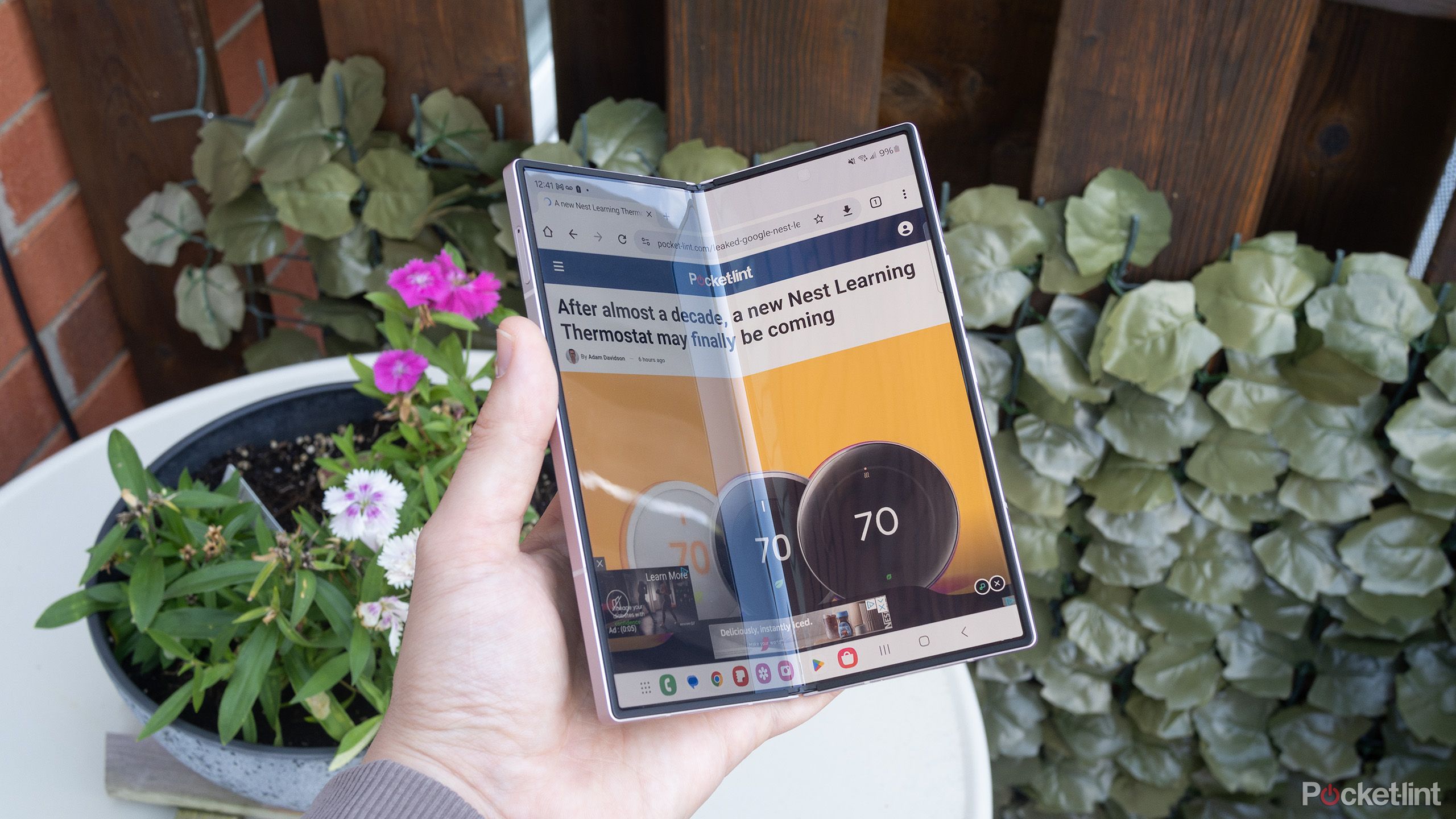 Samsung's Galaxy Z Fold 6 unfolded outside with glare on the screen