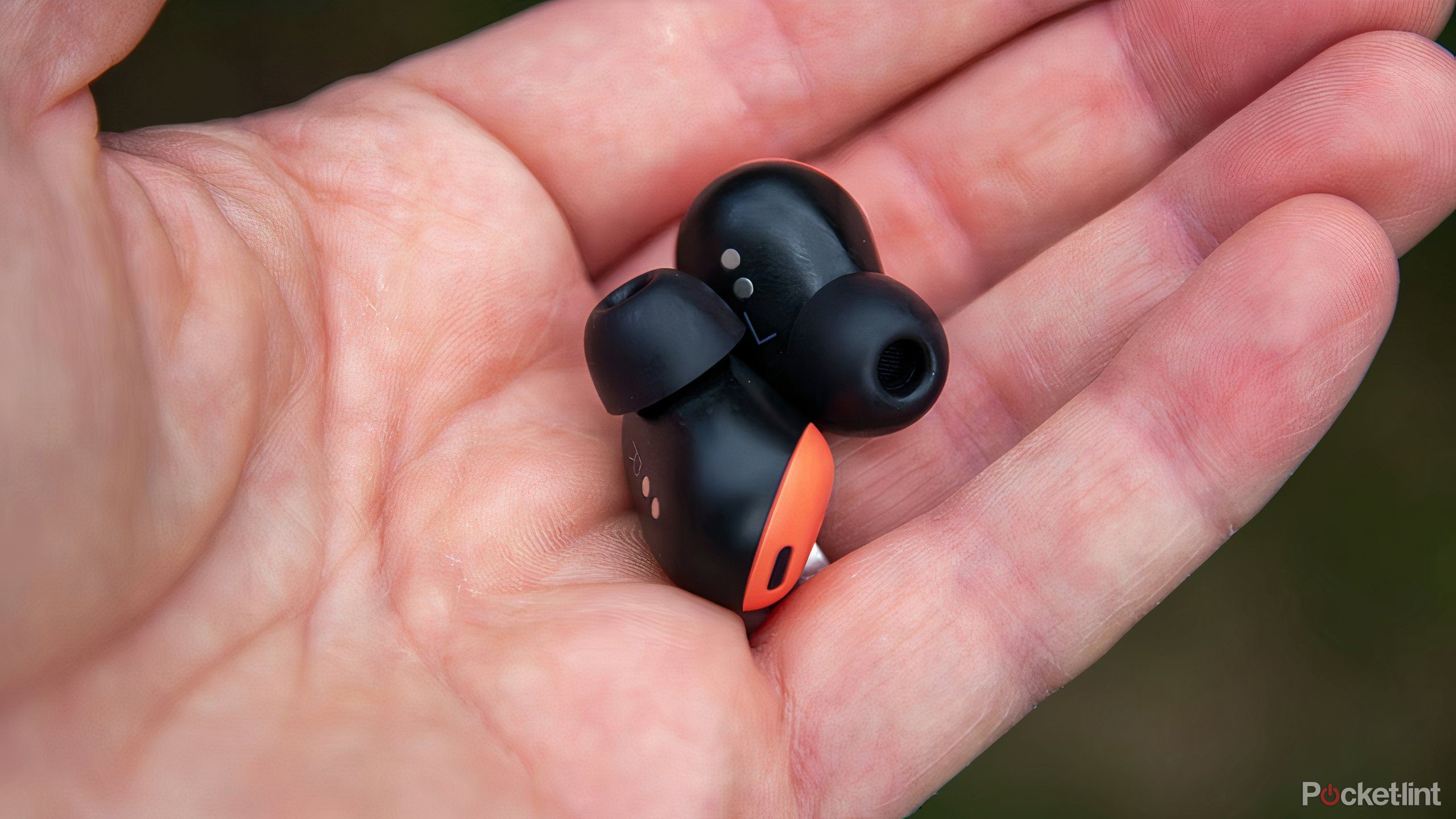 Place your Pixel Buds Pro face up in the palm of your hand.