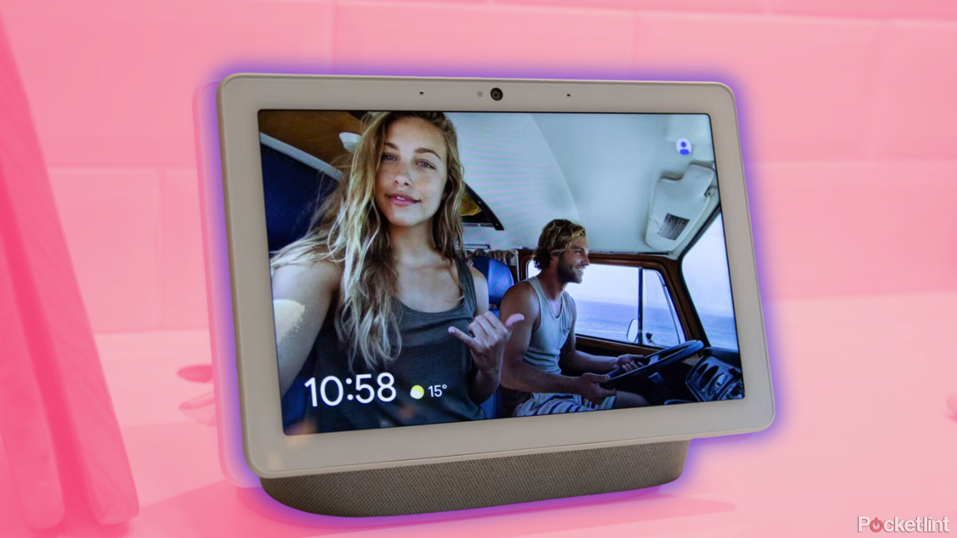 A man and a woman drive a van beside the ocean on a Google Nest Hub Max.