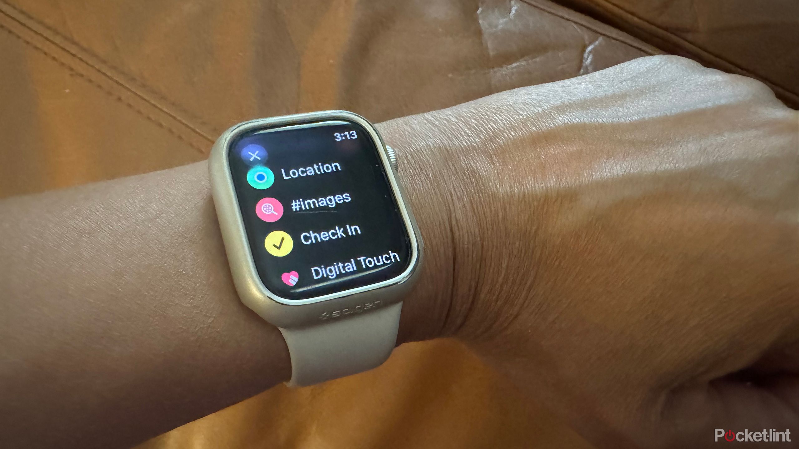 An Apple Watch on a wrist showing the Check In option.