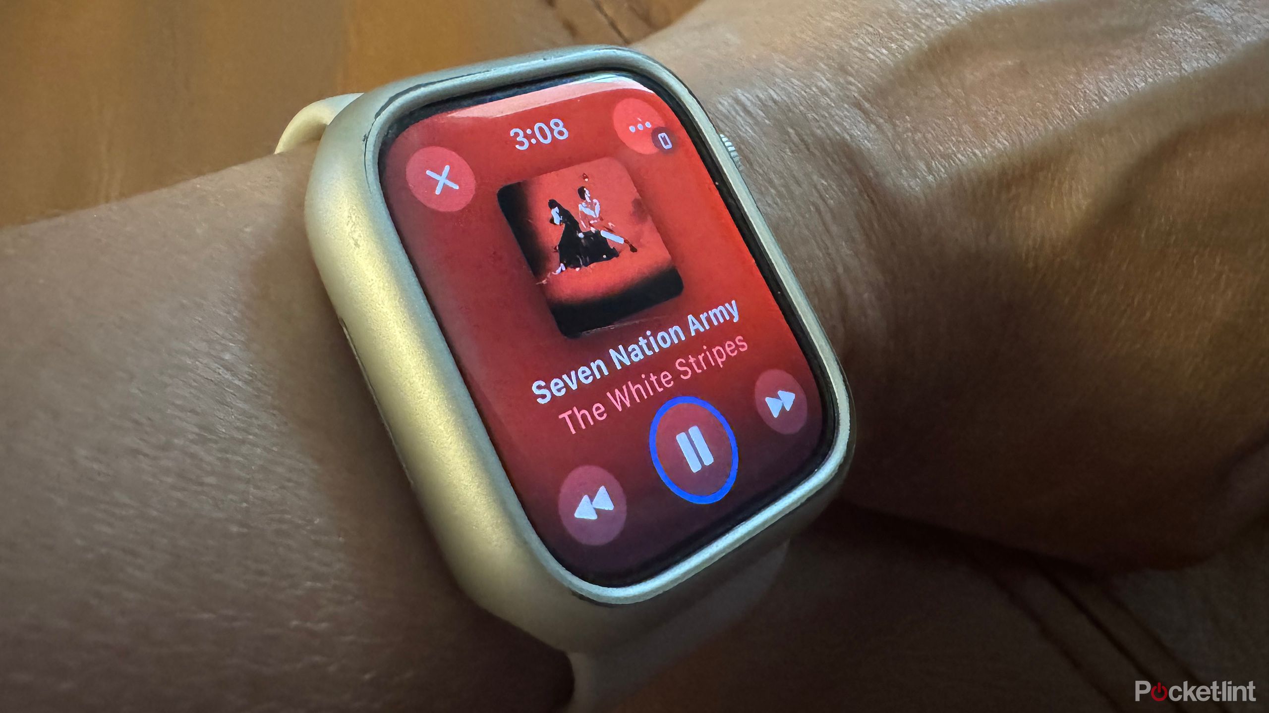 An Apple Watch showing a song being played from Apple Music.