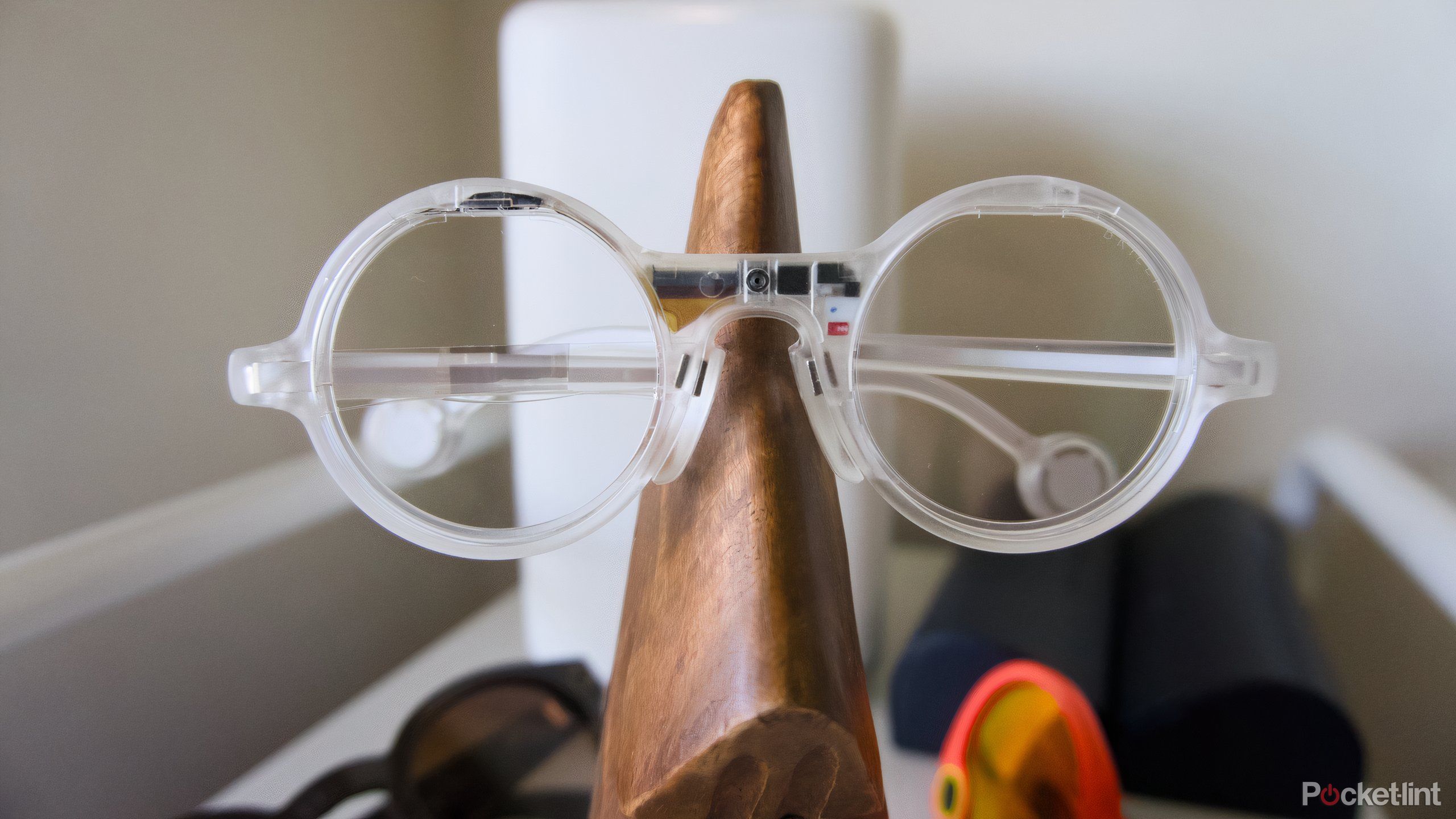 The Frame glasses mounted on a wooden nose.