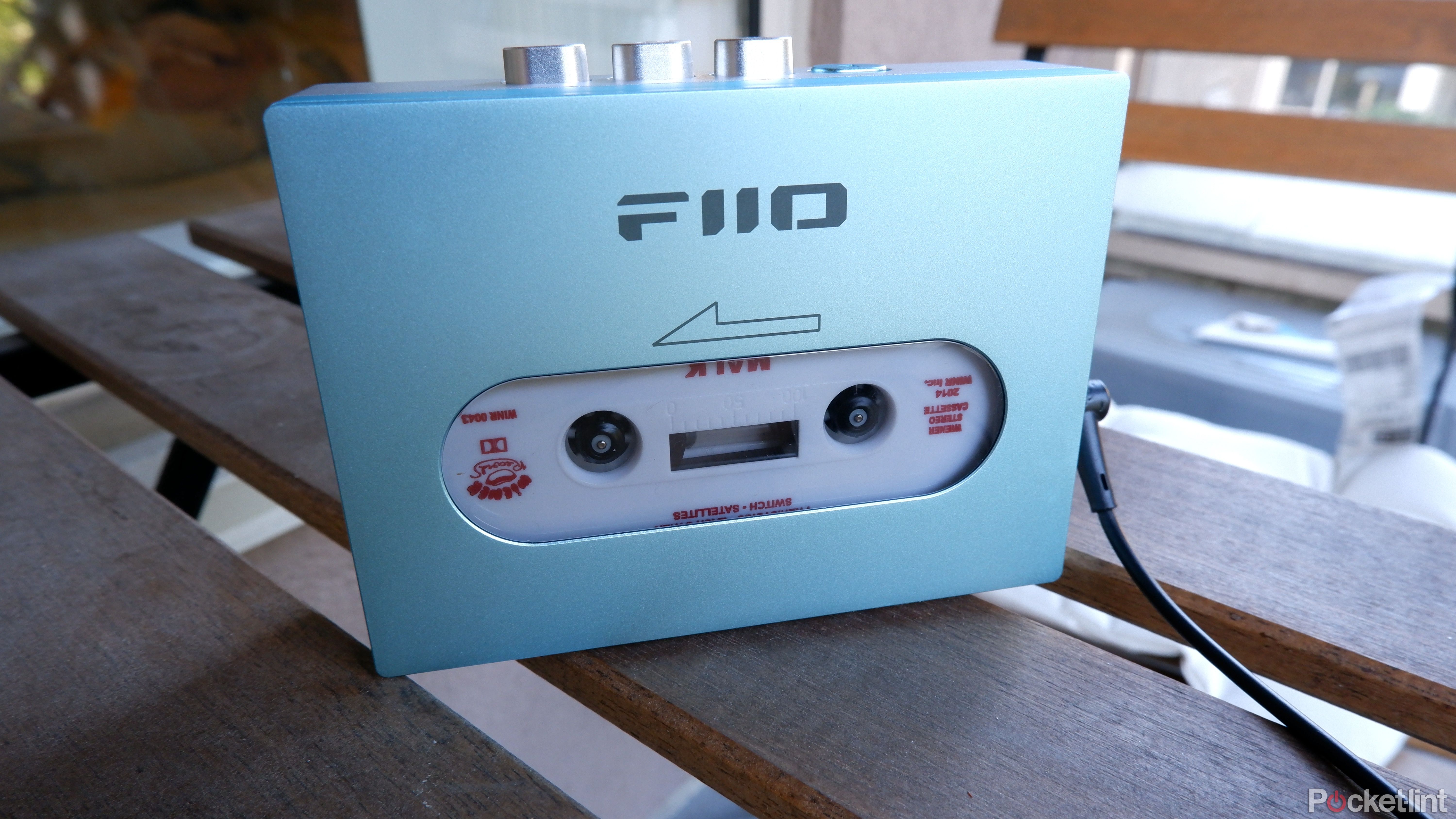 The Fiio CP13 standing up on a patio table