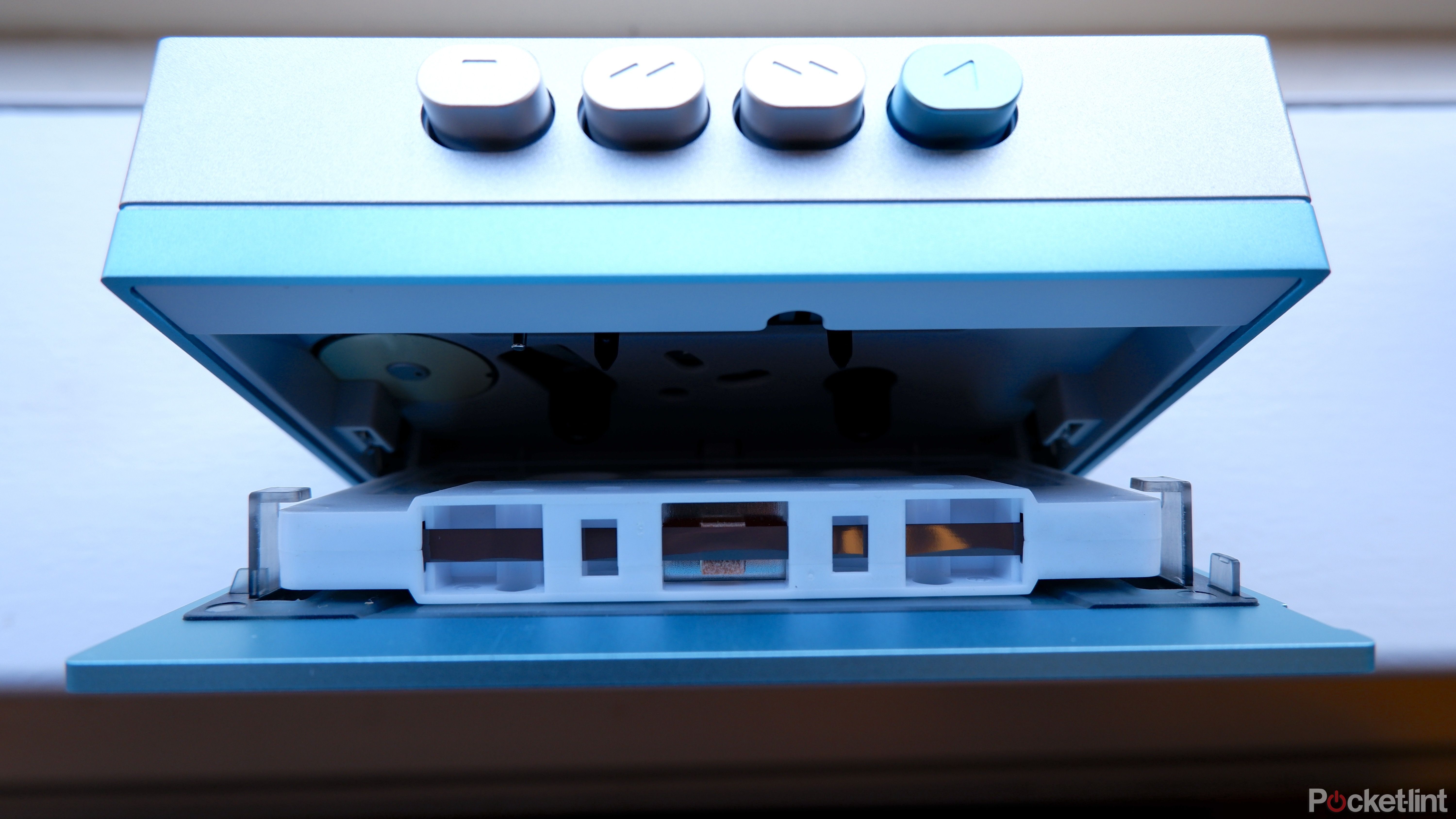 The inside of the Fiio CP13 cassette player from above, with a tape inserted into the player.