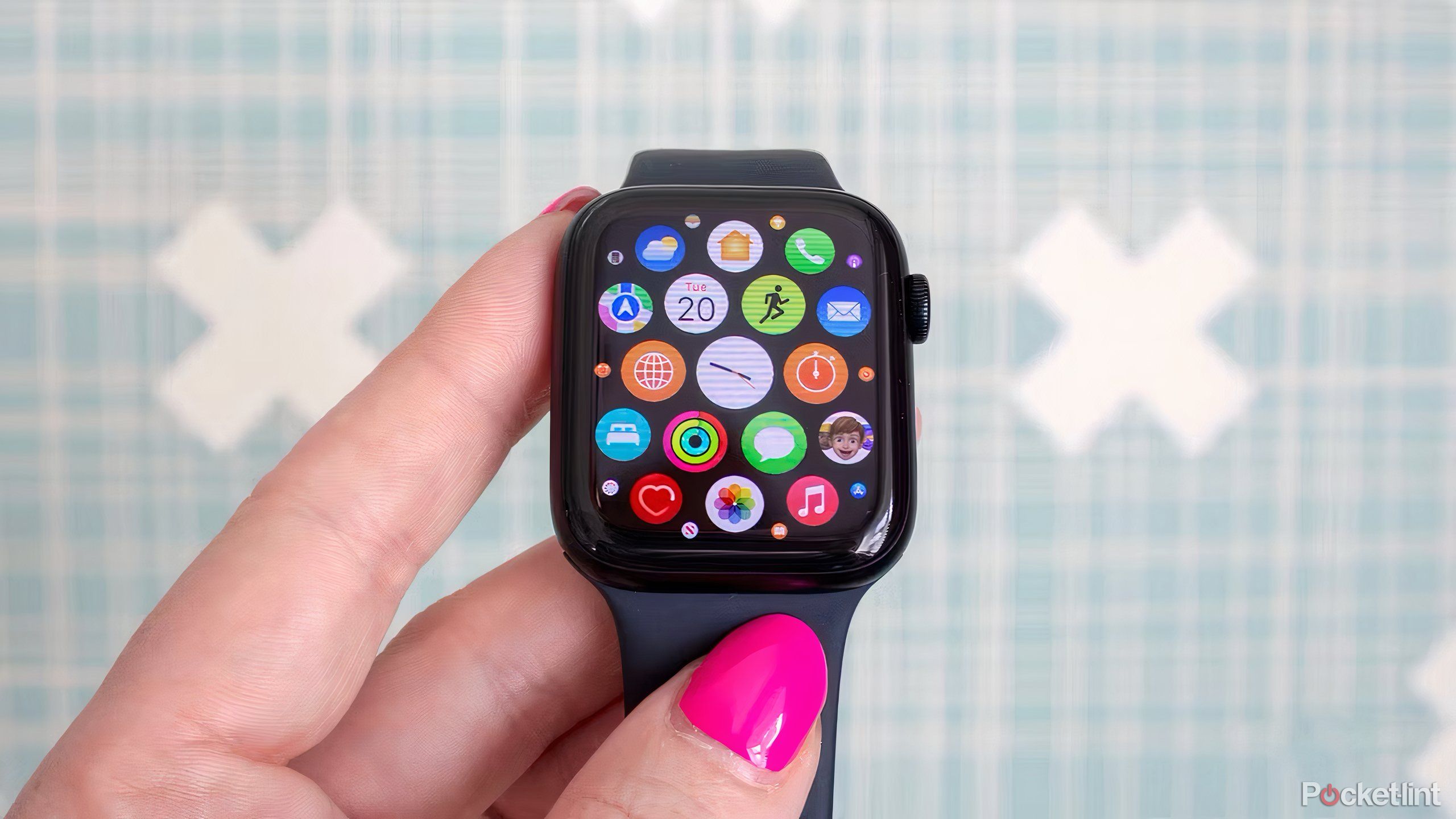 An Apple Watch SE showing the honeycomb-shaped app launcher.