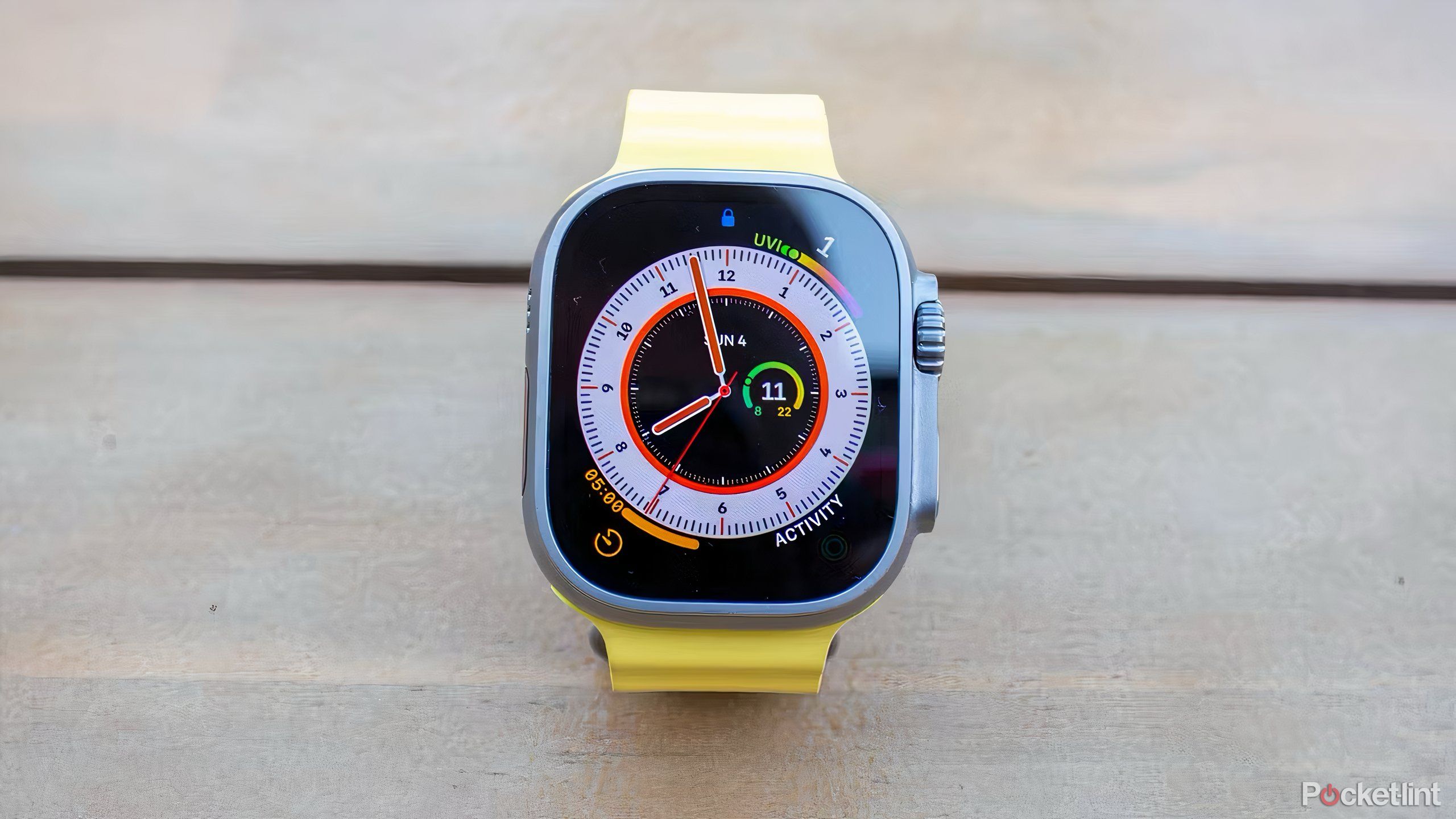 An Apple Watch Ultra 2 with a watch face with multiple different complications.