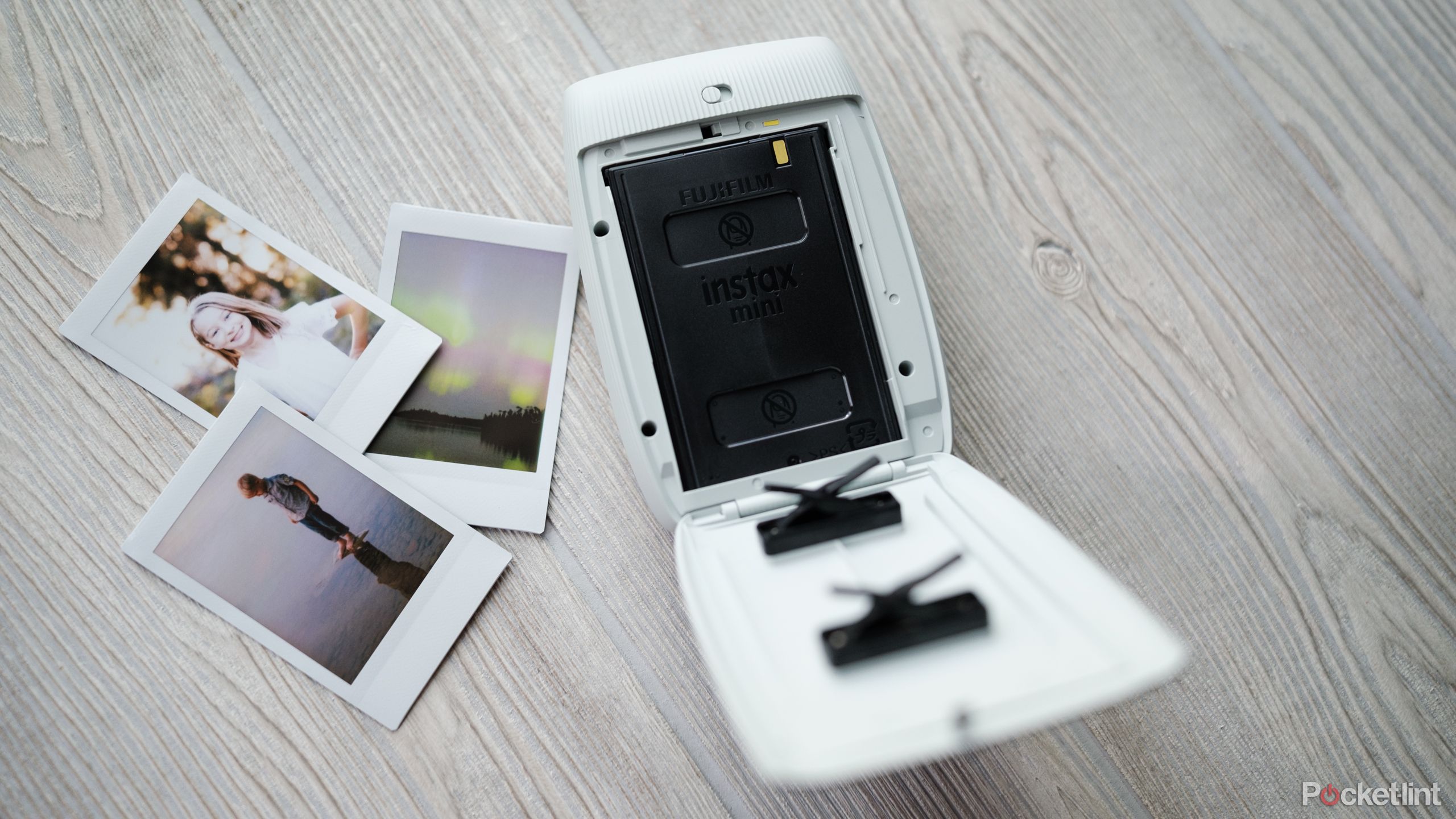 A photograph of the Fujifilm Instax Mini Link 3 with the film door open