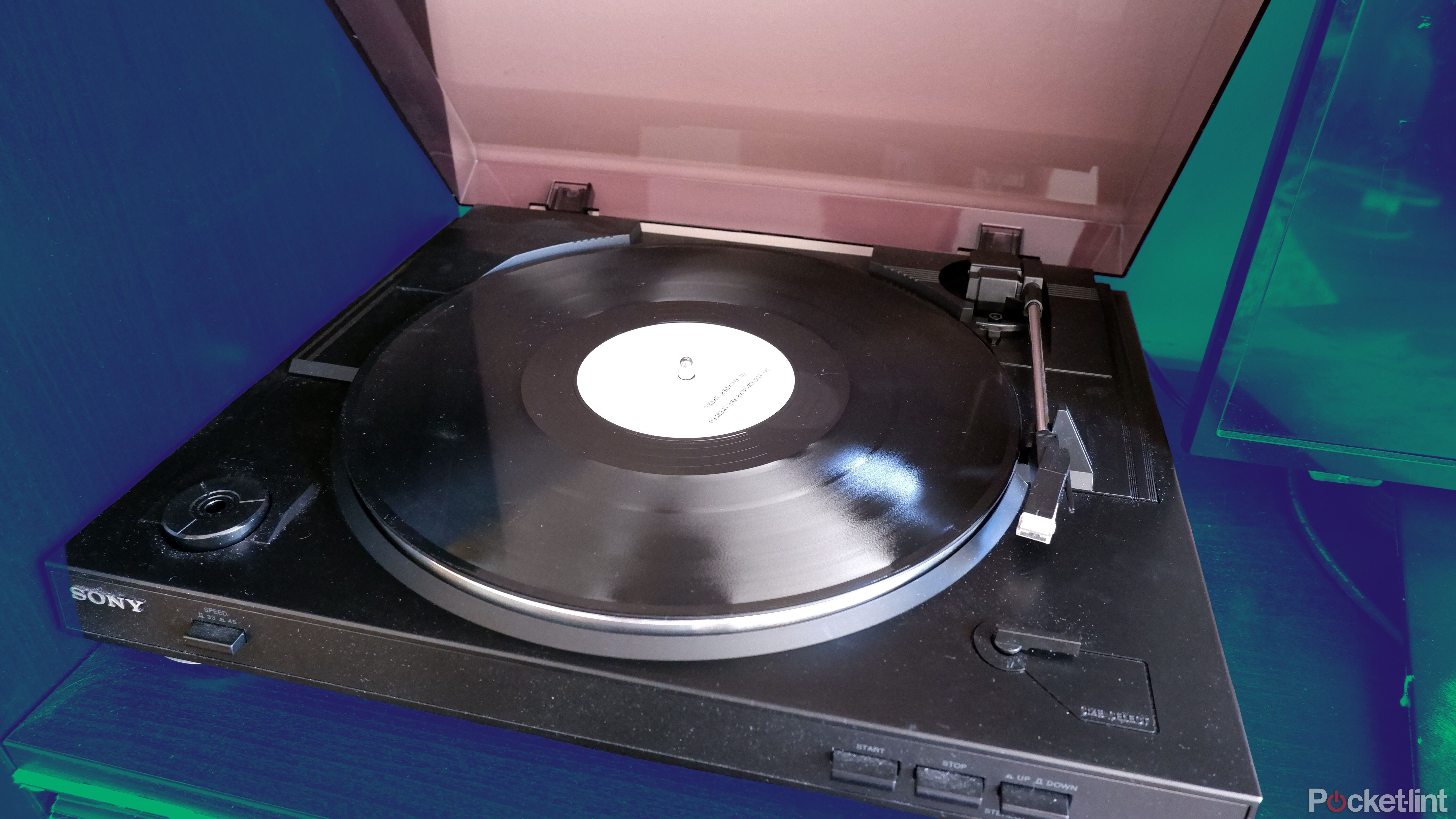 A Sony record player with a record on the turntable, with the lid open.