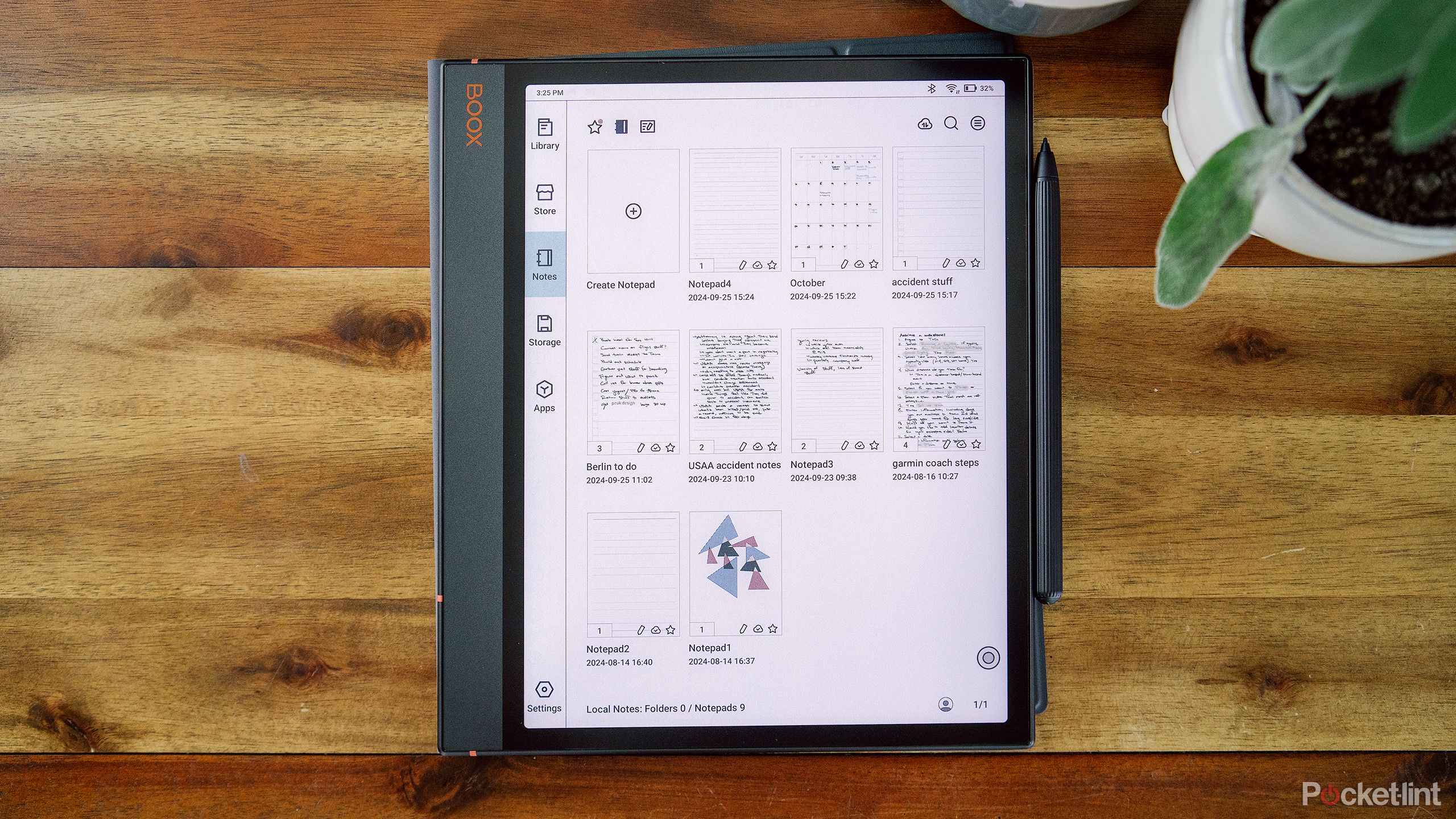 The Onyx Boox Note Air 3 C sits on a wood table with the note taking app on the display.