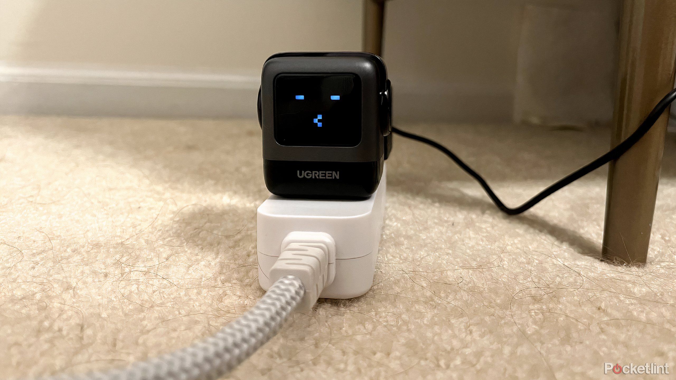 ugreen uno charger 65w on the ground