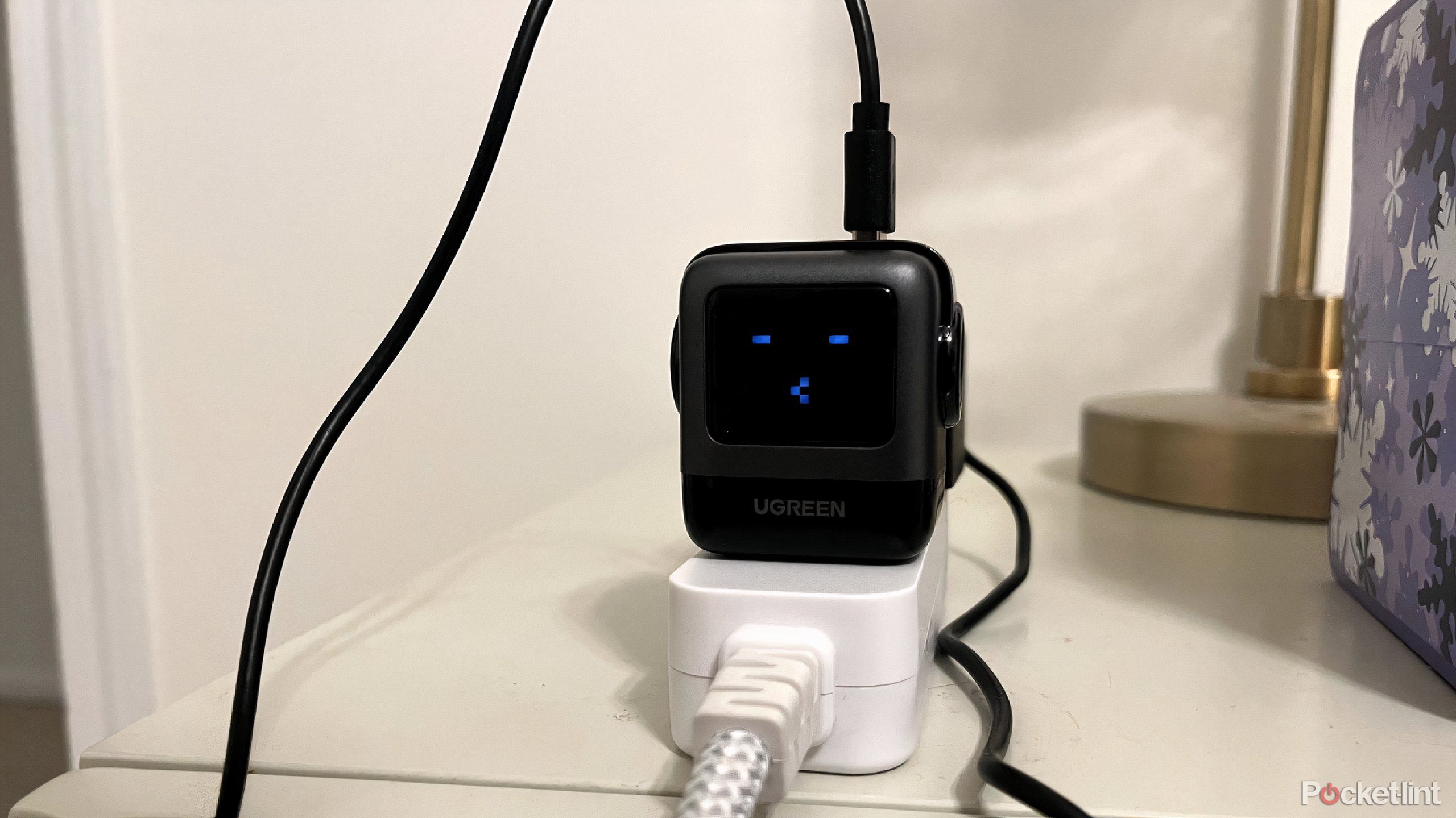 ugreen uno charger 65w in a power strip