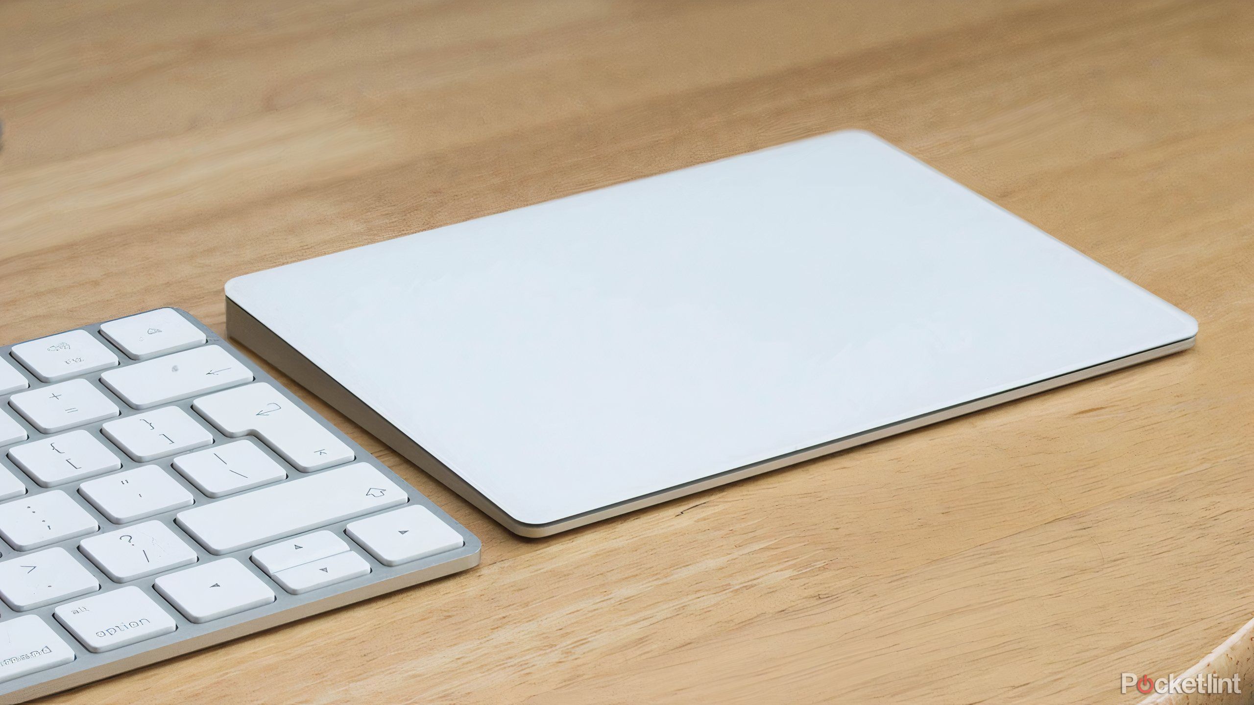 Apple Magic Trackpad 2 and Magic Keyboard on a desk