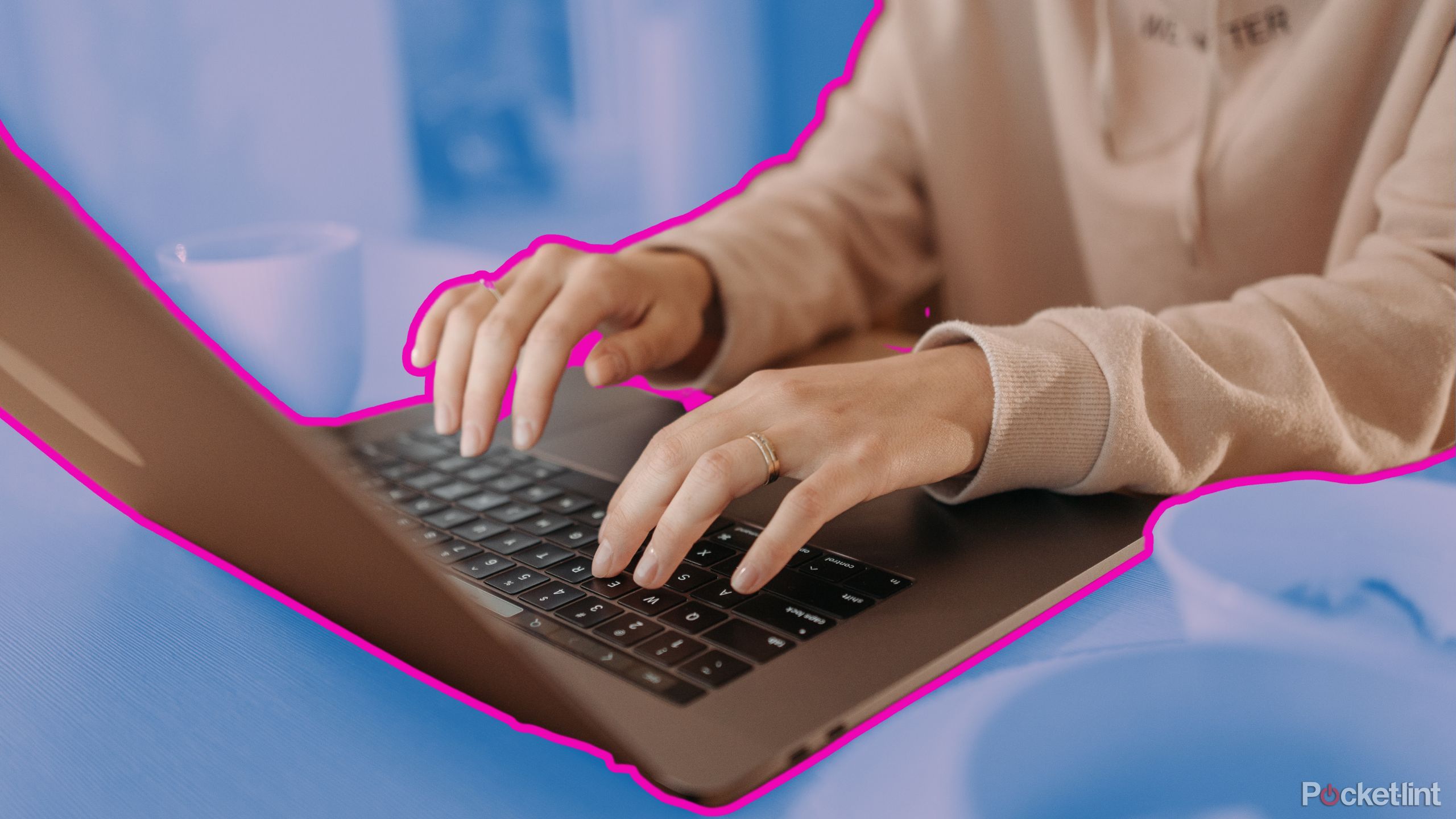 A woman typing on a laptop outlined with pink. 