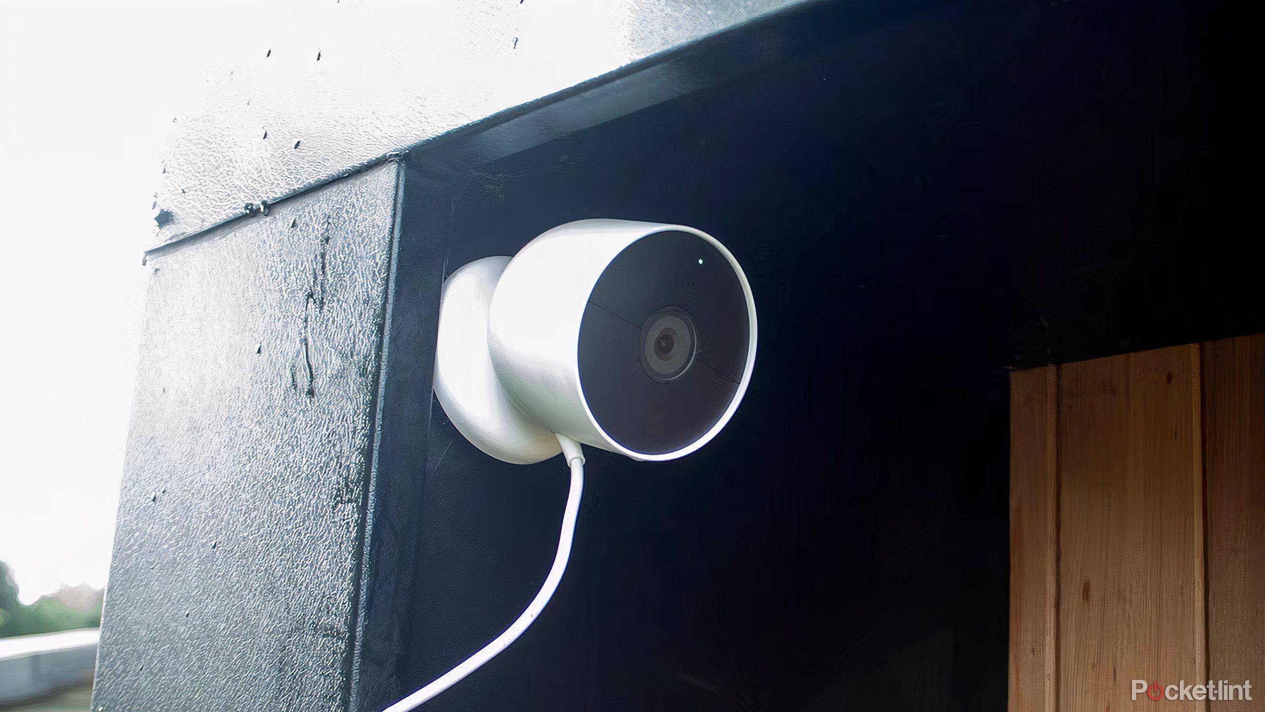 The Google Nest Cam battery outside with a wire