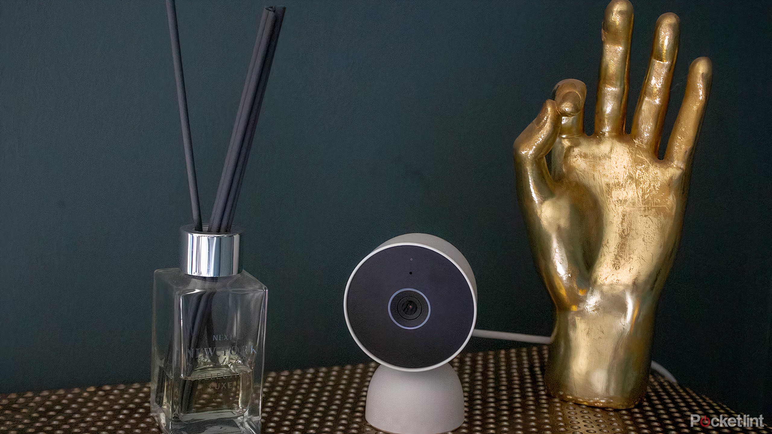 The Google Nest Cam wired on table with props