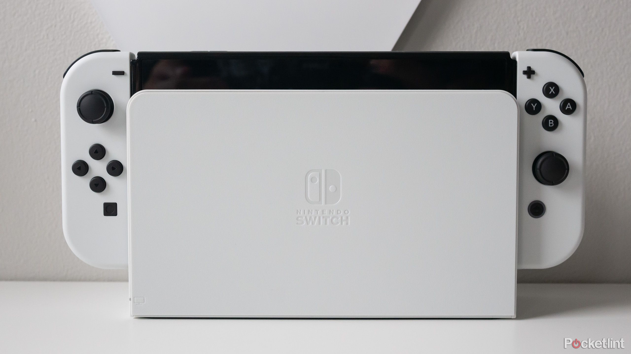 The Switch OLED model in its dock 