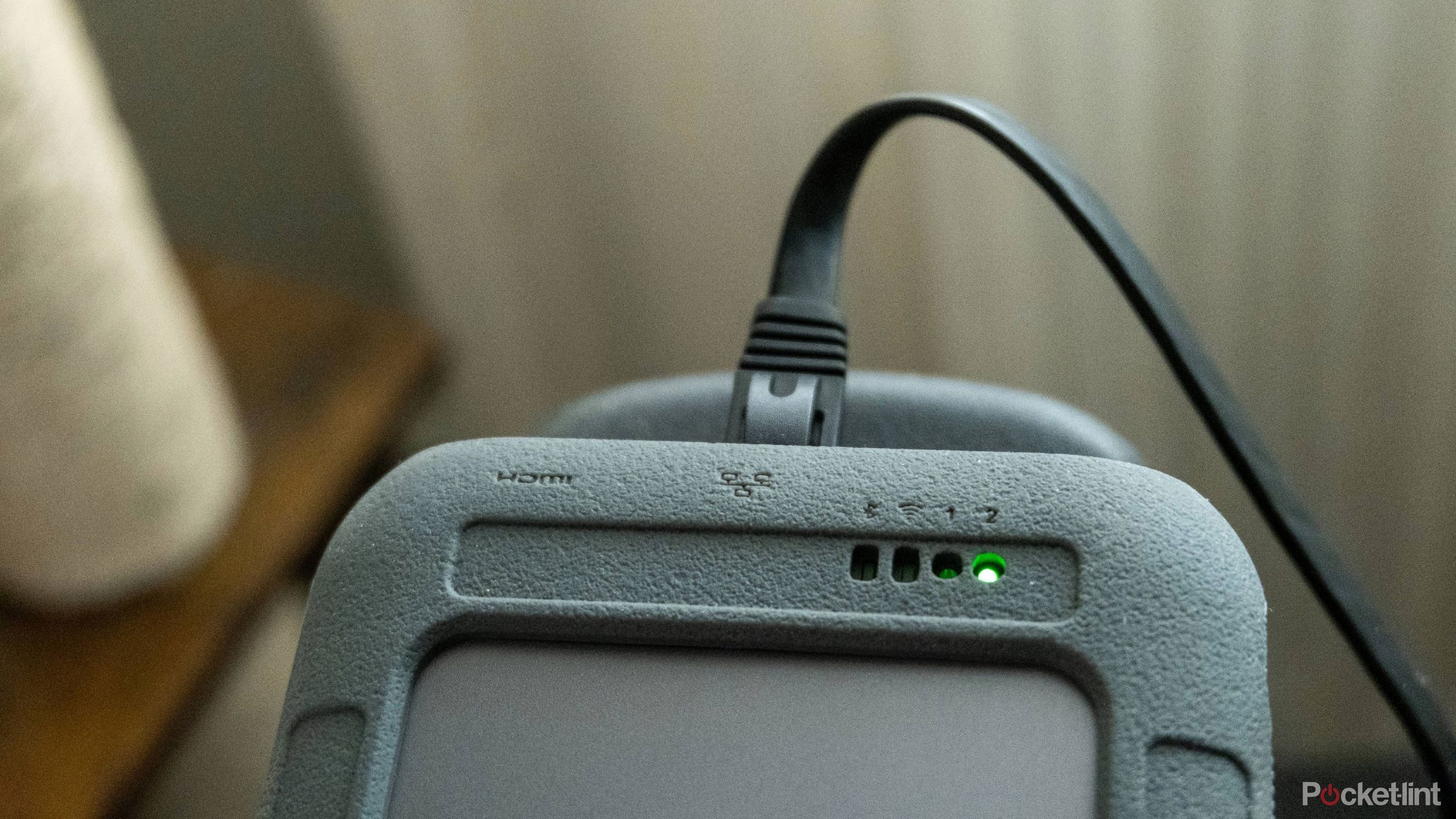 A photograph of the UnifyDrive UT2 with an Ethernet cable plugged in.