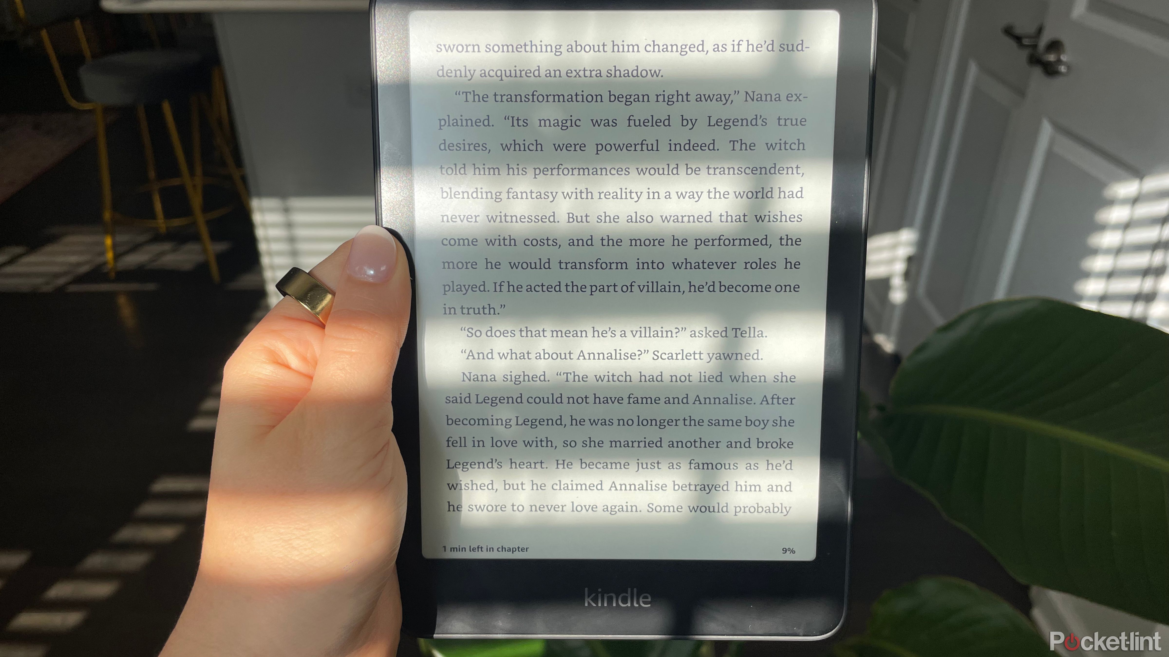 A person holding a Kindle Paperwhite 2024. 