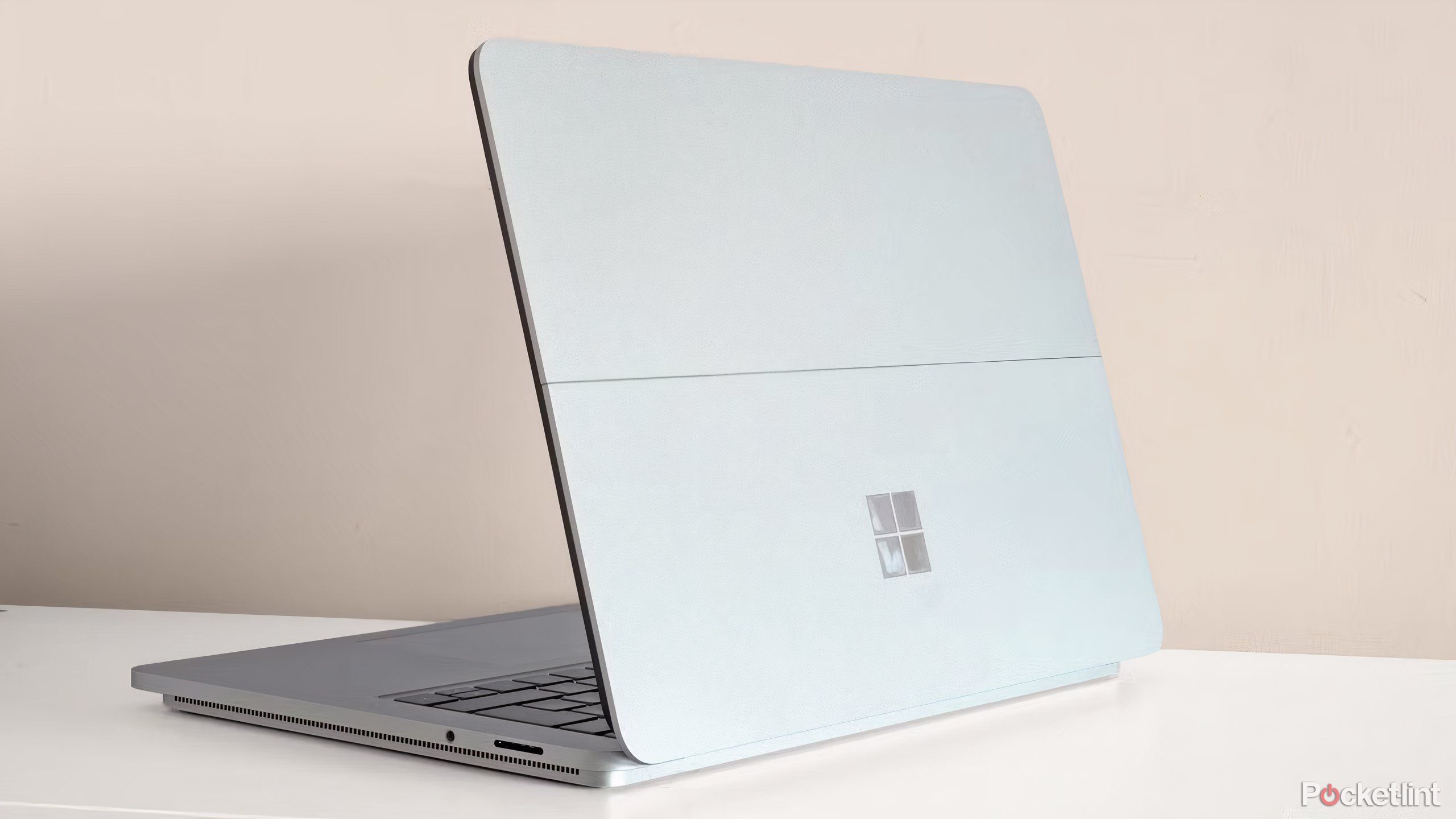 A Microsoft Surface laptop studio open on white surface. 