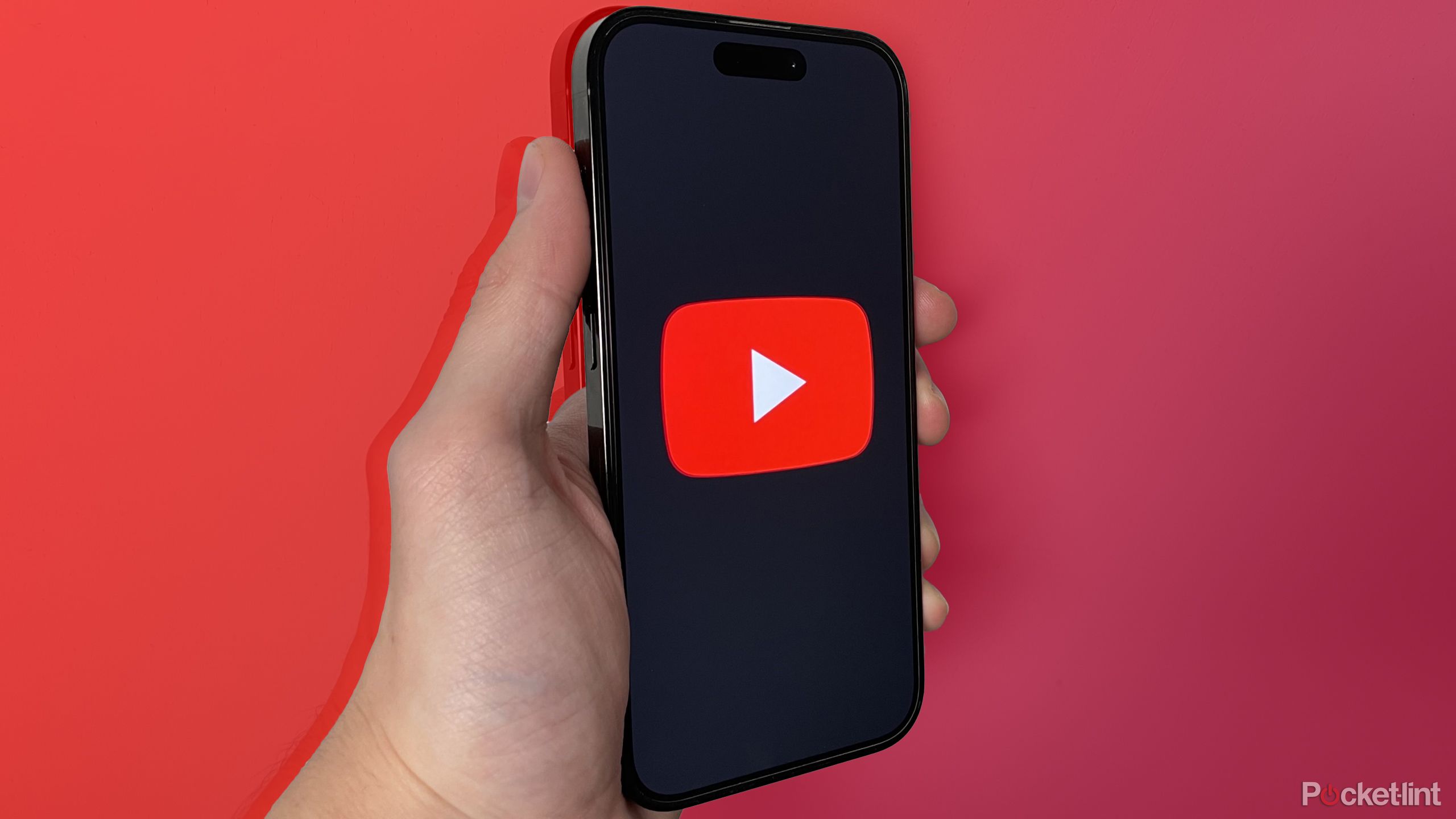 YouTube logo on iPhone with red background