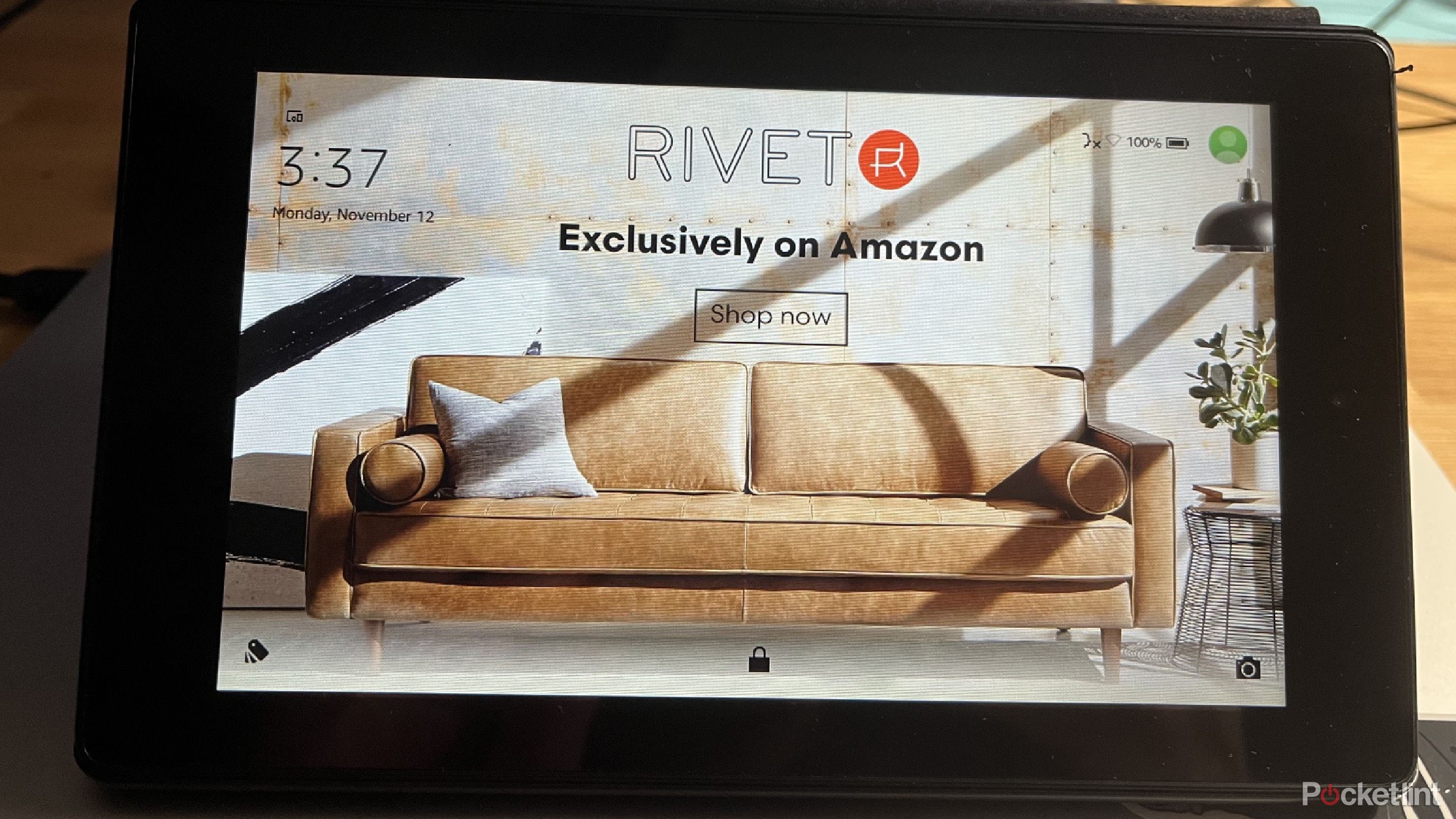 Kindle Fire 2 with a couch on it. 