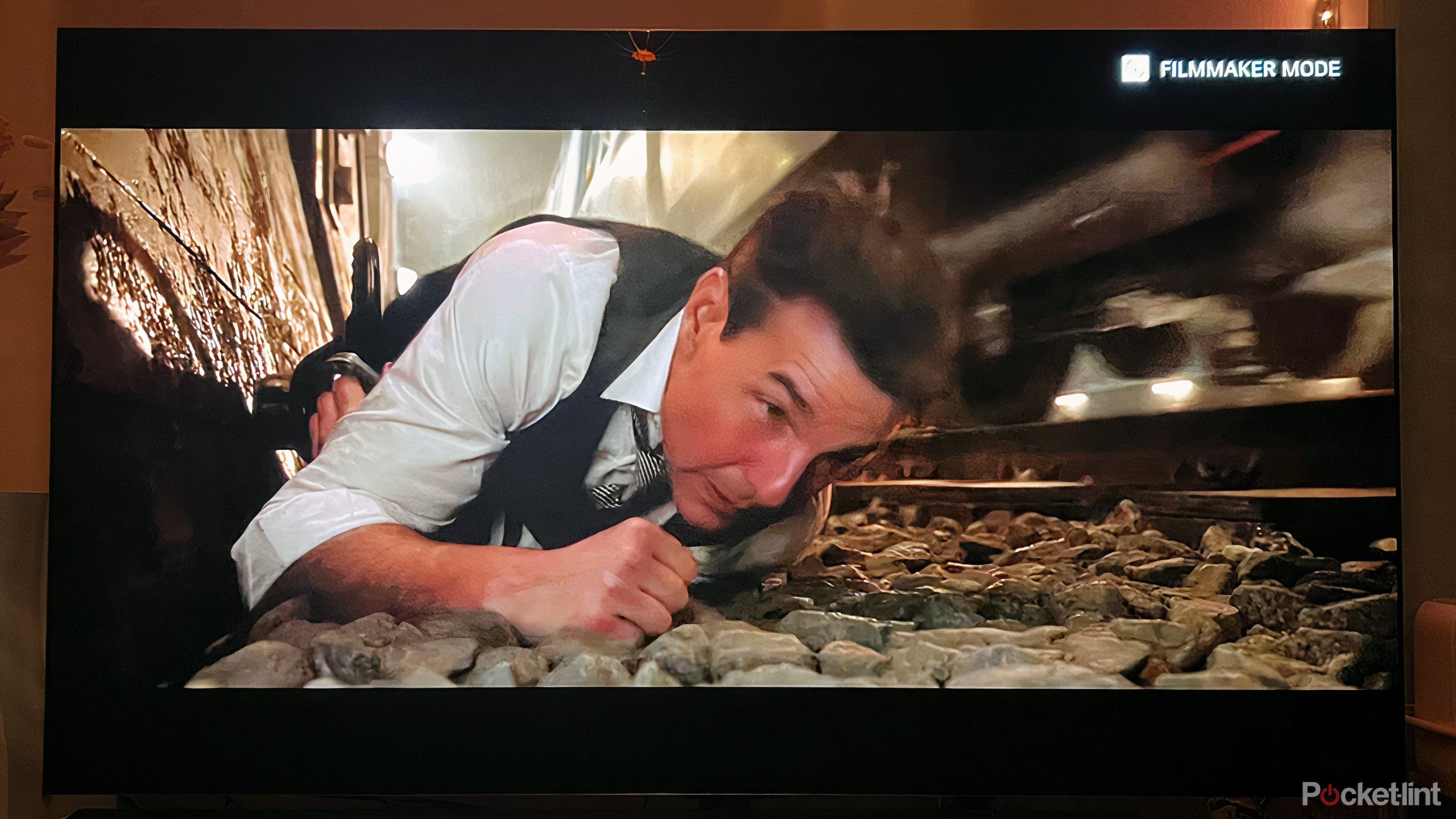 Tom Cruise laying beside a moving train. 