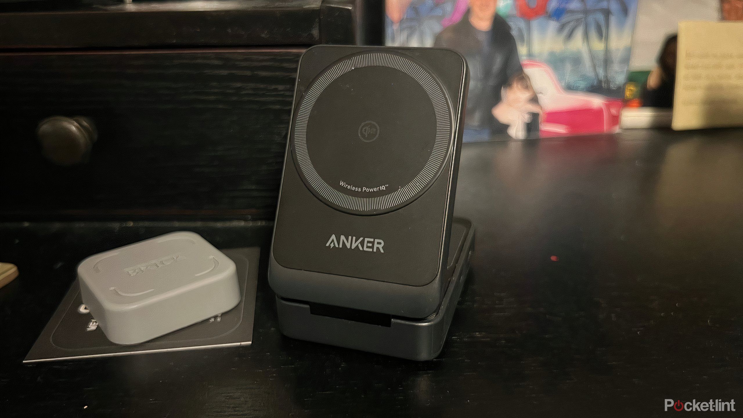 Anker MagGo Wireless Charging Station on a table next to Brick.